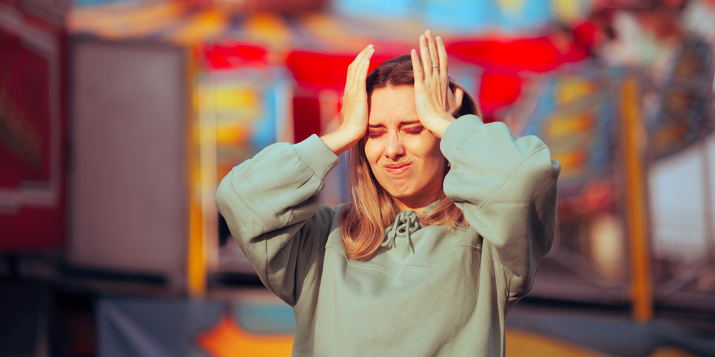 A worried woman at an amusement park | Source: Getty Images