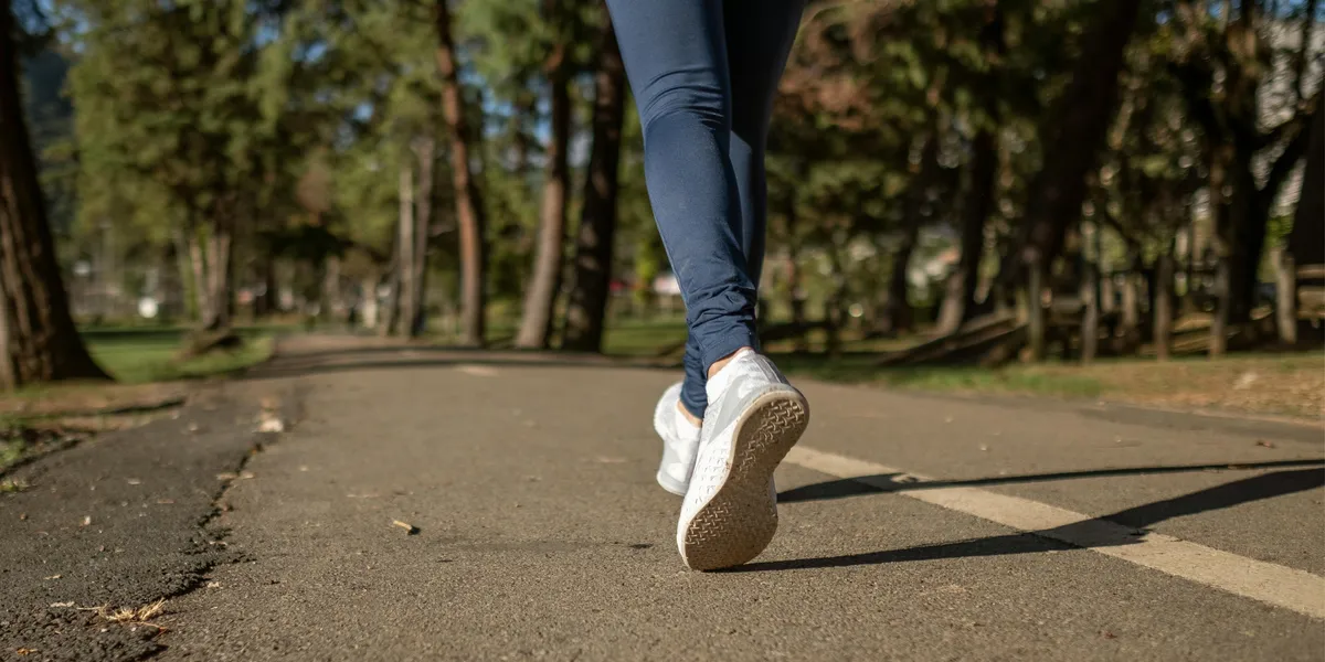 A person jogging on a road | Source: Pexels