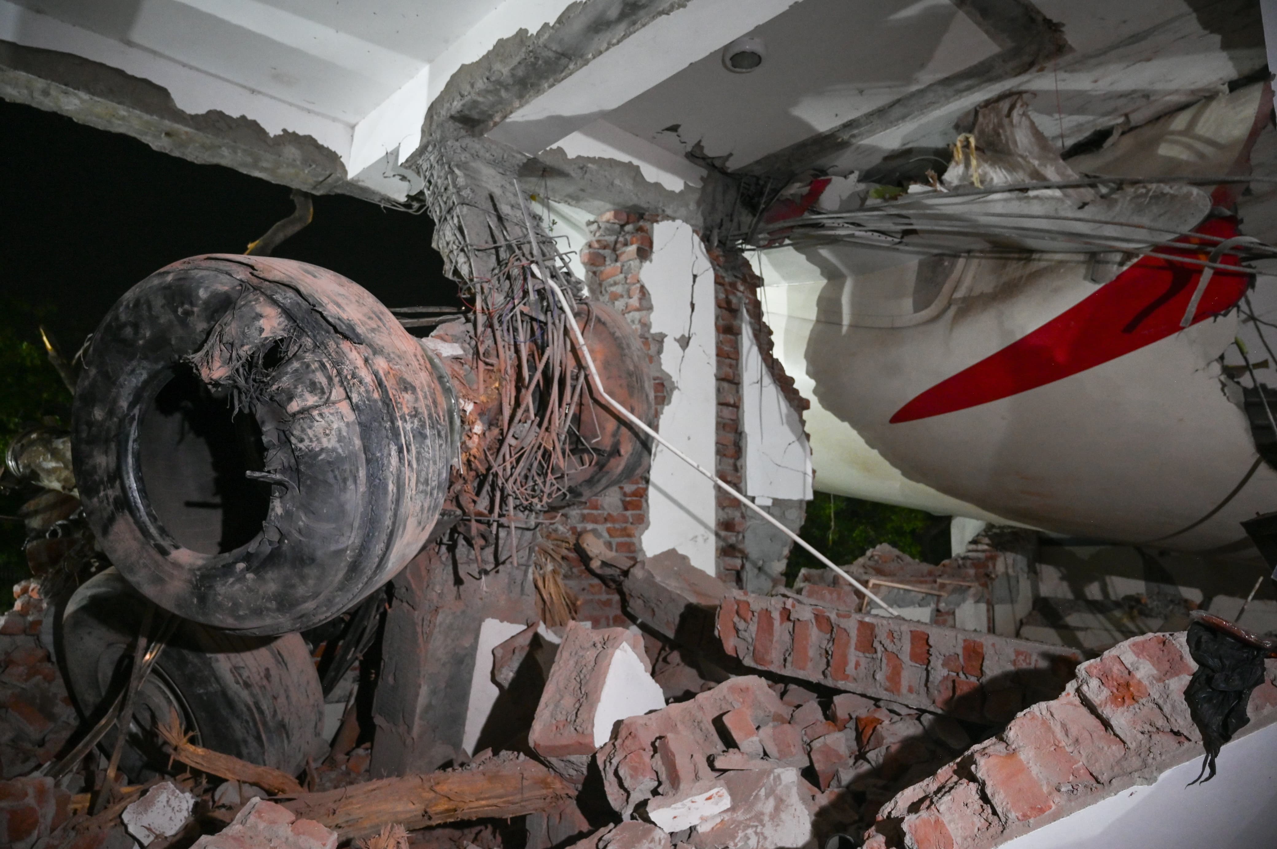 Wreckage of Air India Flight 171 embedded in the walls of a medical hostel in Ahmedabad after the plane crashed on June 12, 2025 | Source: Getty Images