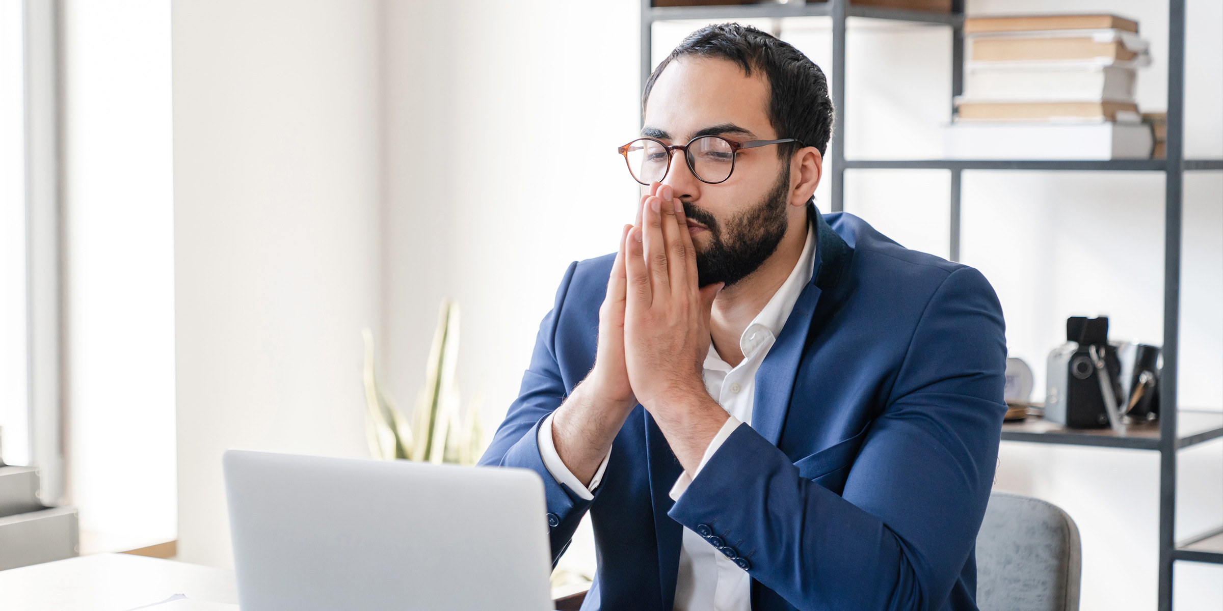 A man sitting in his office | Source: Shutterstock