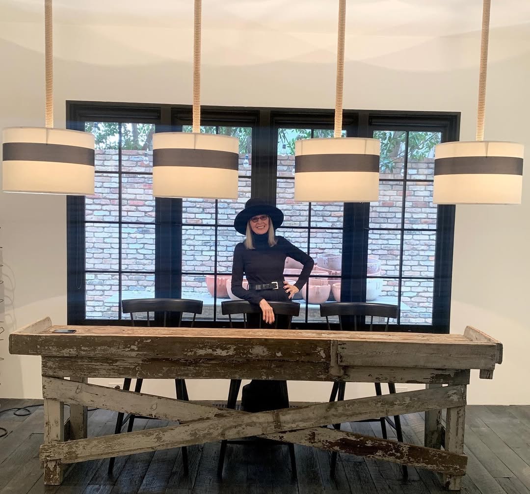 Diane Keaton pictured beneath striped pendant lights at a rustic wood counter inside her Sullivan Canyon home, dated January 29, 2021 | Source: Instagram/diane_keaton