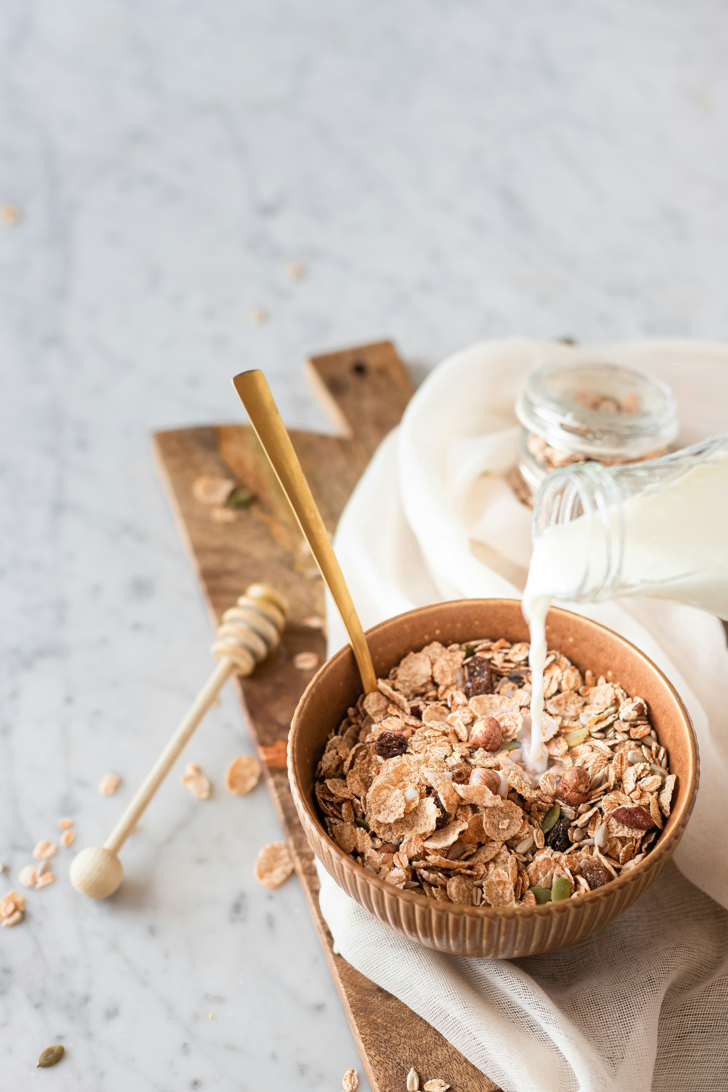 Milk being poured into cereal | Source: Unsplash