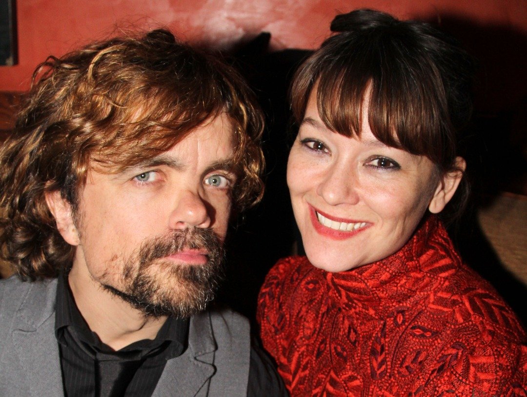Peter Dinklage and wife director Erica Schmidt pose at the opening night party for "Taking Care of Baby" at Faces & Names Lounge on November 19, 2013 | Source: Getty Images