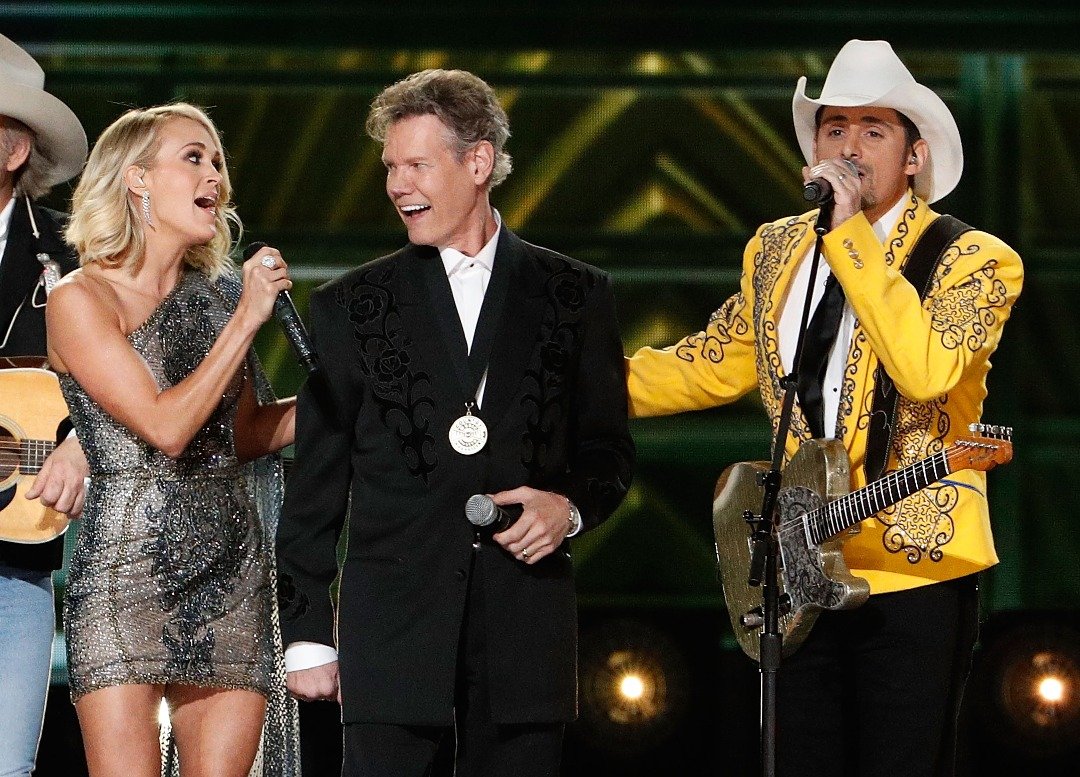  Carrie Underwood, Randy Travis and Brad Paisley perform onstage during the 50th annual CMA Awards at the Bridgestone Arena on November 2, 2016 in Nashville, Tennessee. | Source: Getty Images