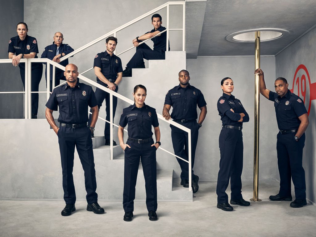 The cast for ABC's "Station 19" pose for a promotional photo in a fire station on November 17, 2019| Source: Justin Stephens via Getty Images