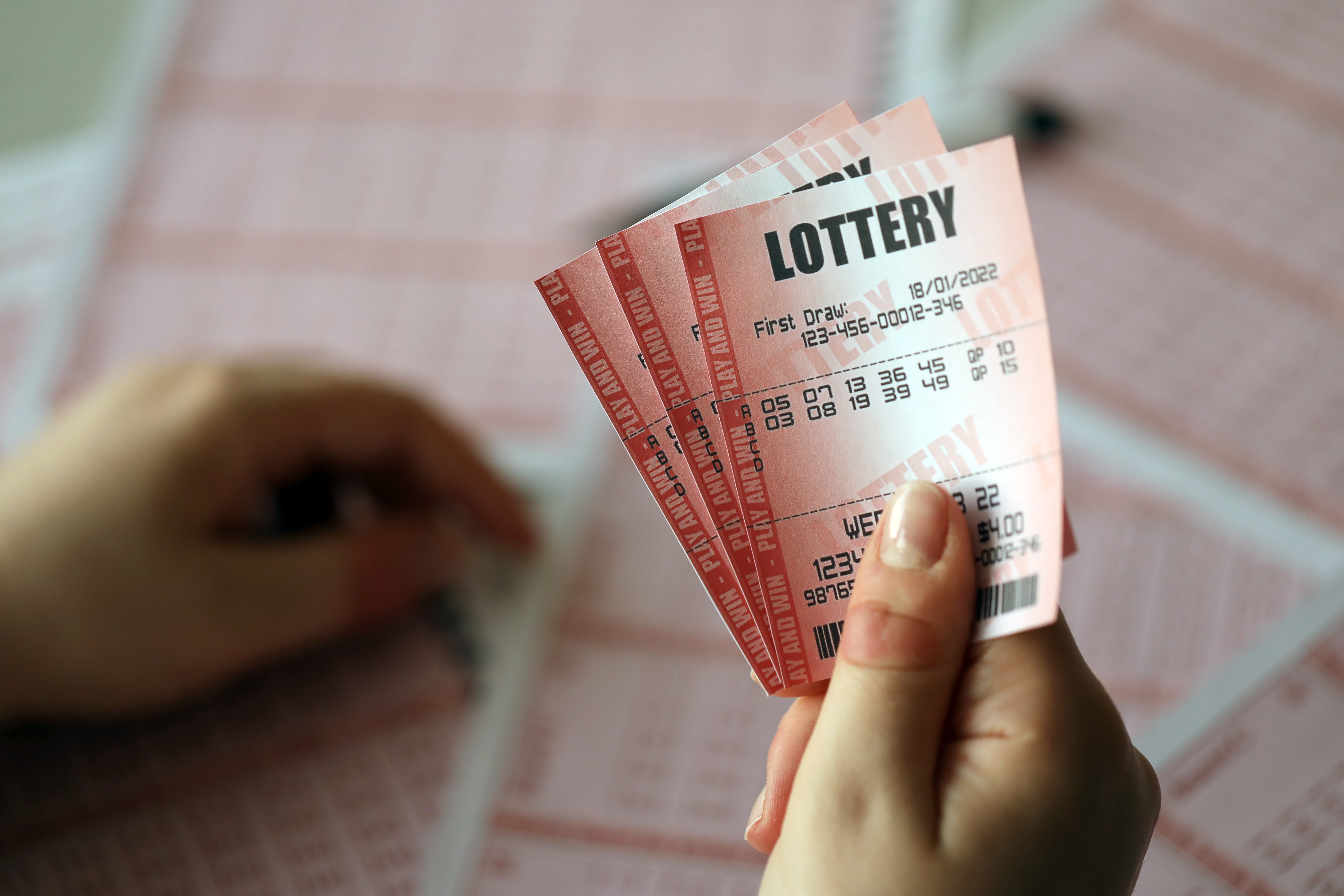 A person holding lottery tickets | Source: Shutterstock