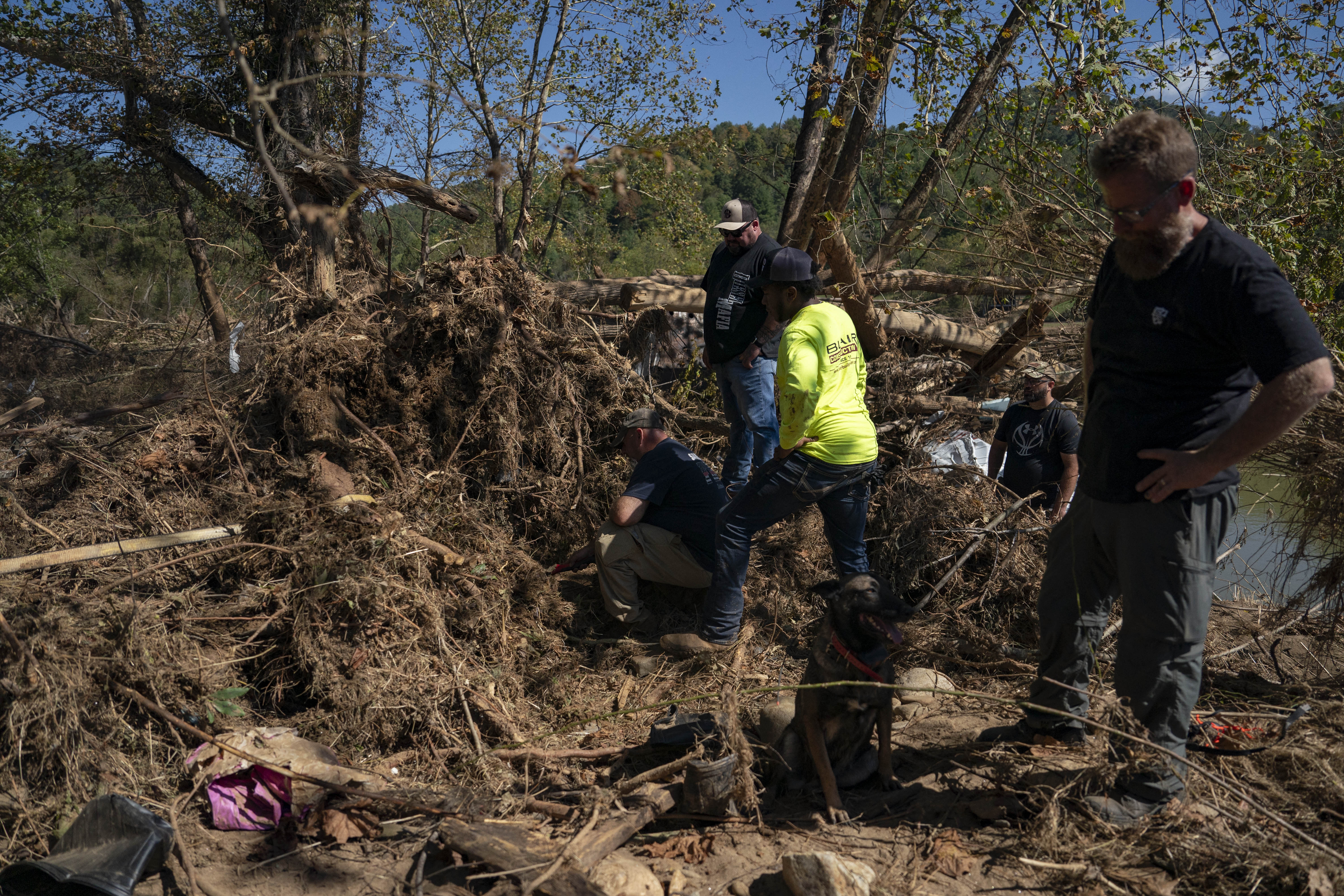 Volunteers digging through rubble after Hurricane Helene in Burnsville, North Carolina on October 5, 2024 | Source: Getty Images