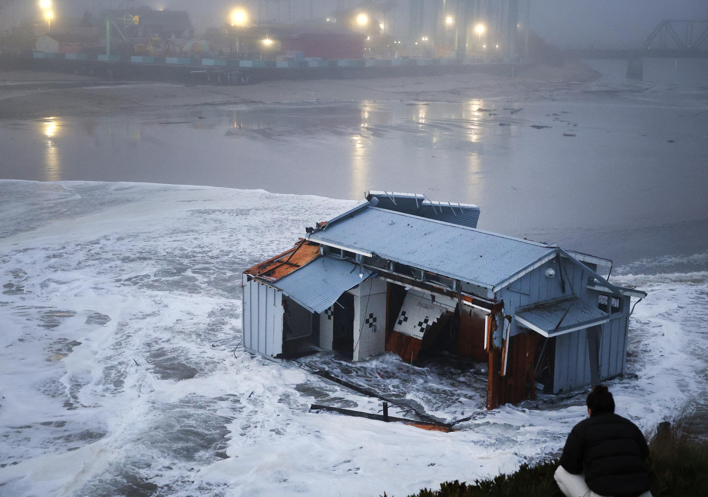 People look at the collapsed pier at the Santa Cruz Wharf in Santa Cruz, California, on December 23, 2024 | Source: Getty Images