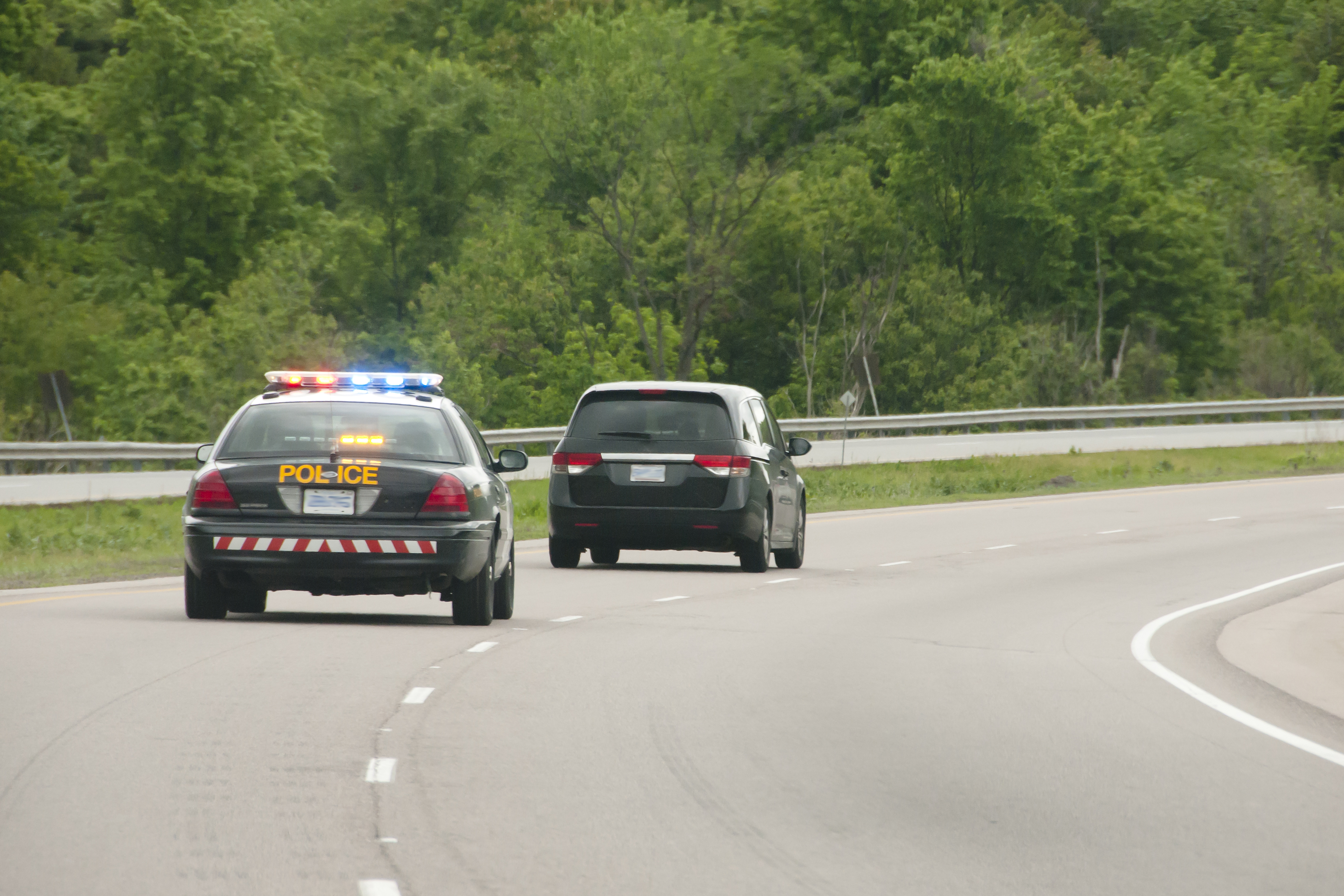 Cops Chasing A Car | Source: Shutterstock
