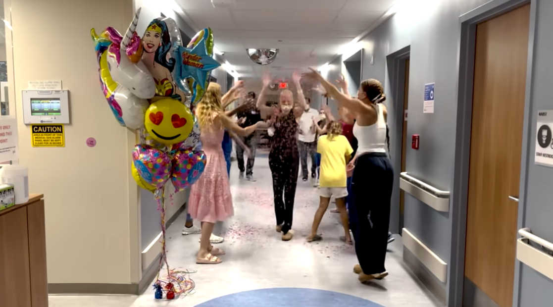 Isabella Strahan walks at the hospital lobby as nurses and her family shower her with pink confetti, June 2024. | Source: | Source: YouTube/IsabellaStrahan