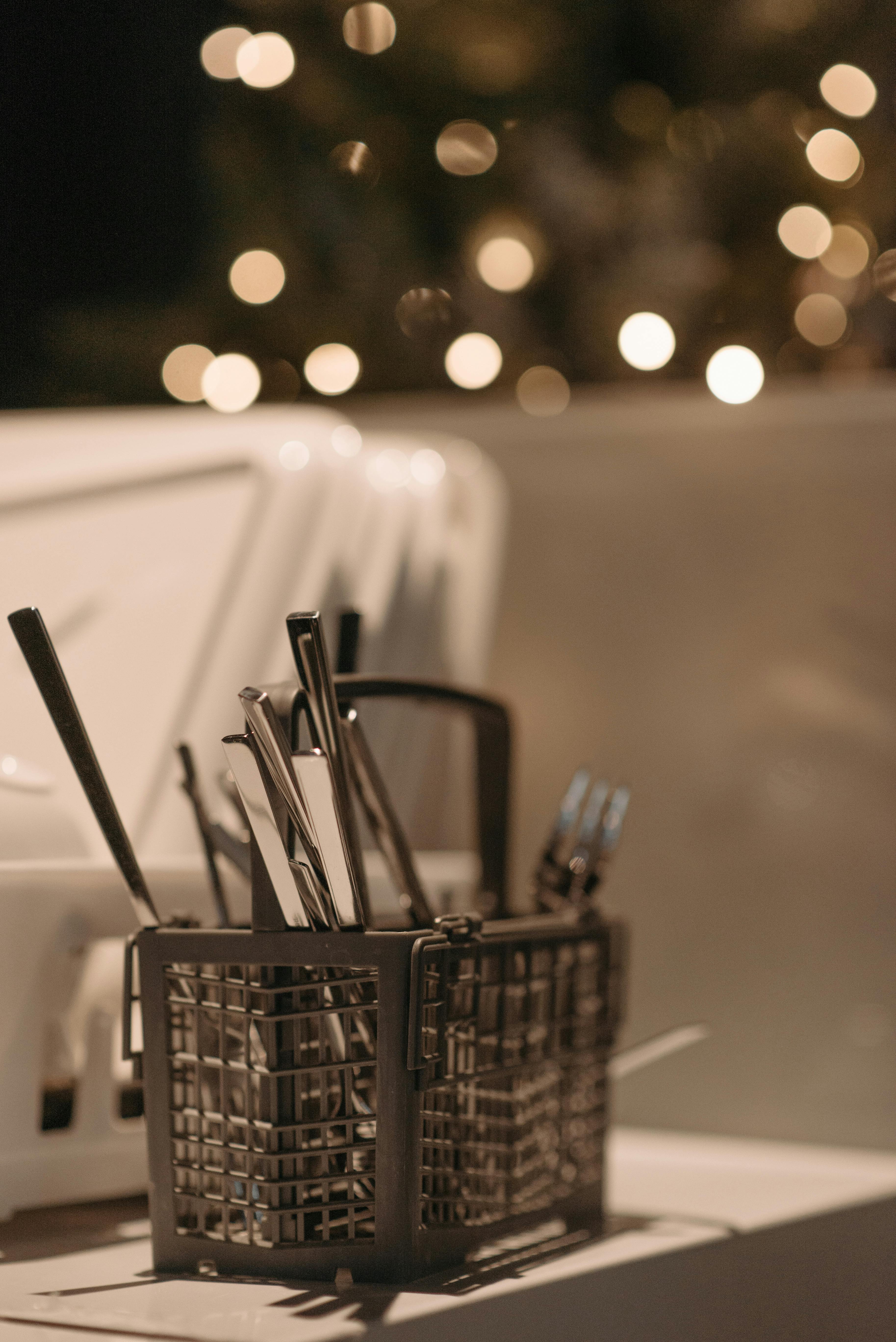 Utensils placed upside down on a dishwasher | Source: Pexels