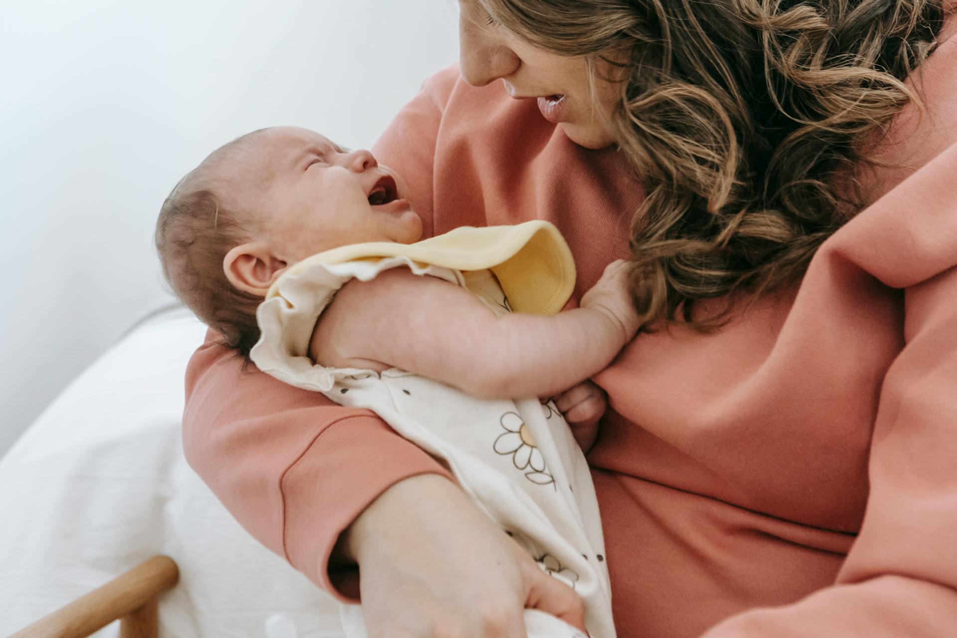 A woman soothing her crying baby | Source: Pexels