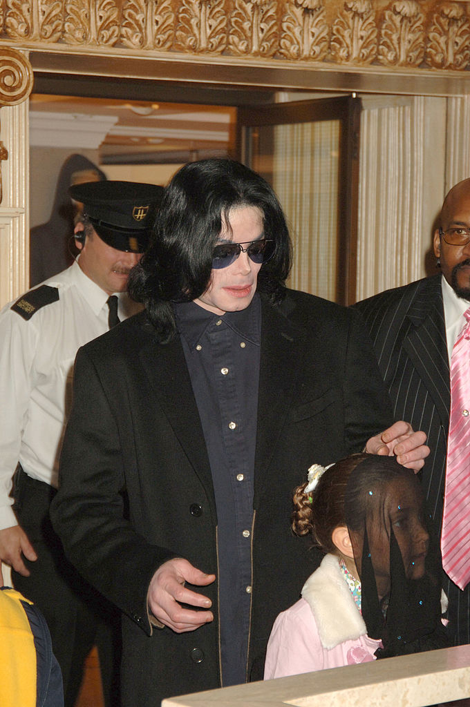 Michael Jackson walks with his children, Prince and Paris, as they visit Harrods October 12, 2005 in London, England | Source: Dave M. Benett/Getty Images