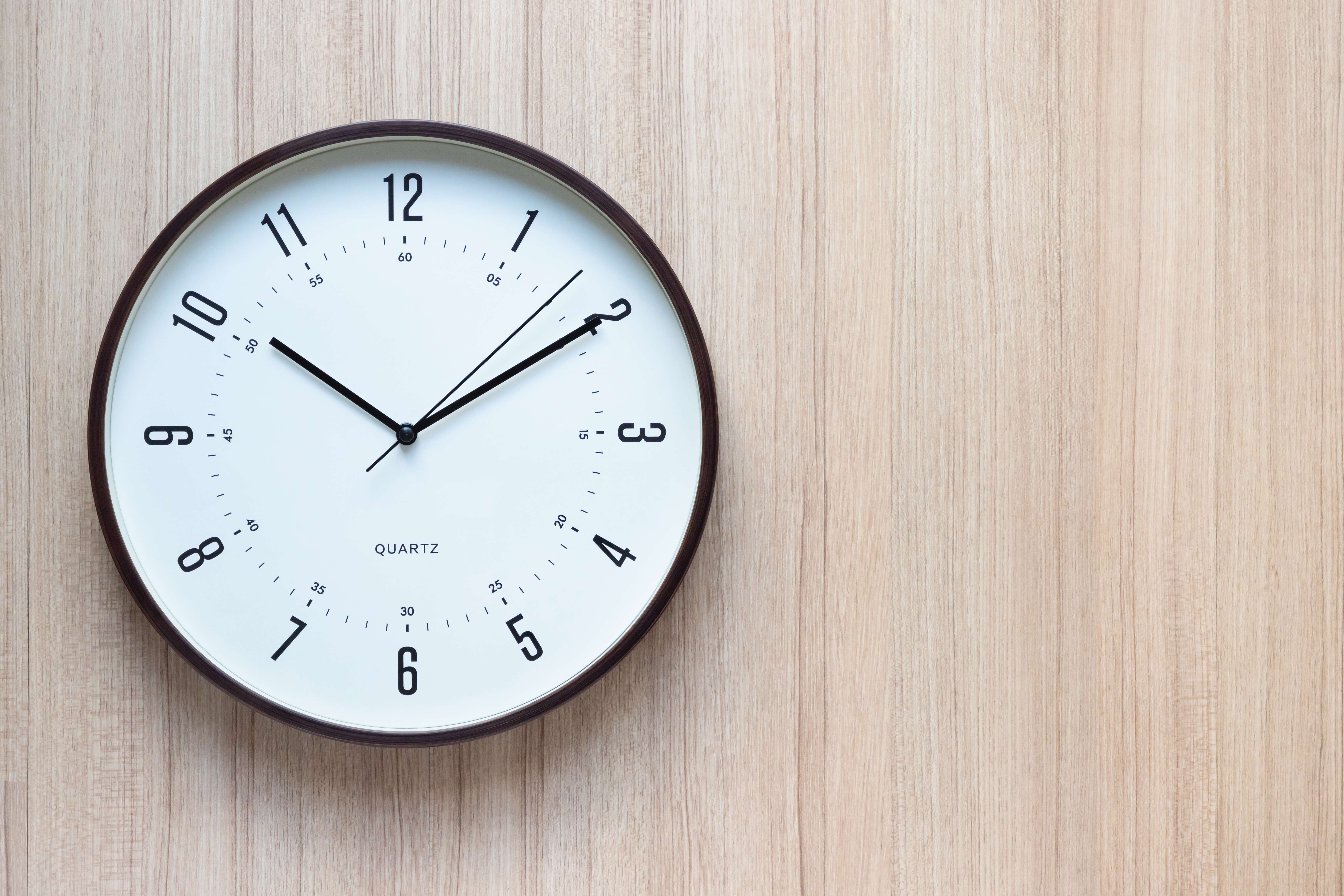 Brown and white clock | Source: Shutterstock