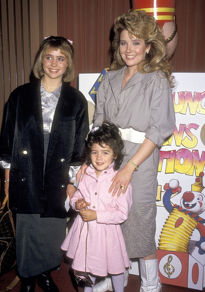 Actress Melody Thomas Scott and daughters Jennifer Scott and Alexandra Scott attend The Young Musicians Foundation's Sixth Annual Celebrity Mother/Daughter Fashion Show on March 26, 1987 | Photo: Getty Images