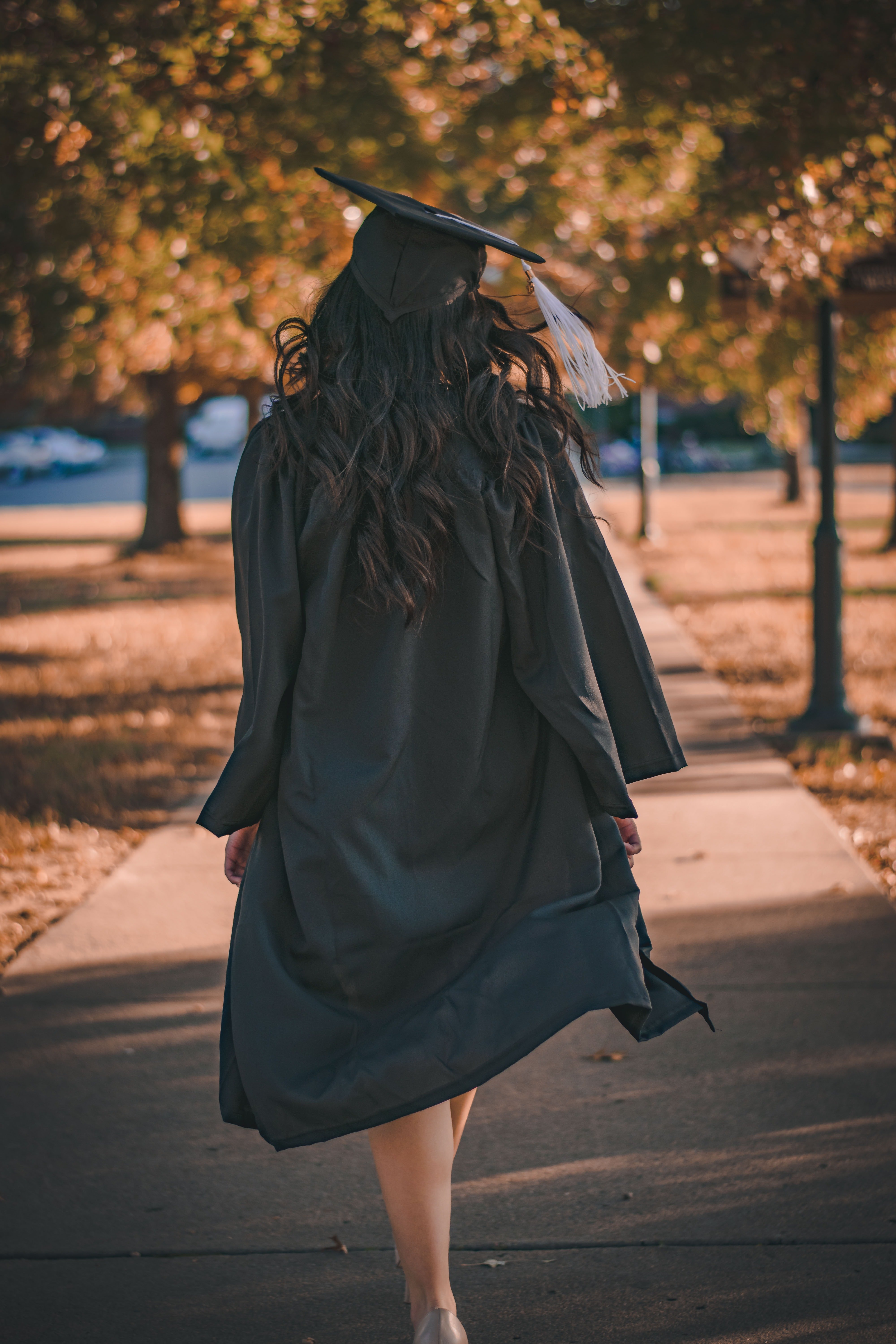 A woman walks away after her graduation ceremony | Source: Pexels