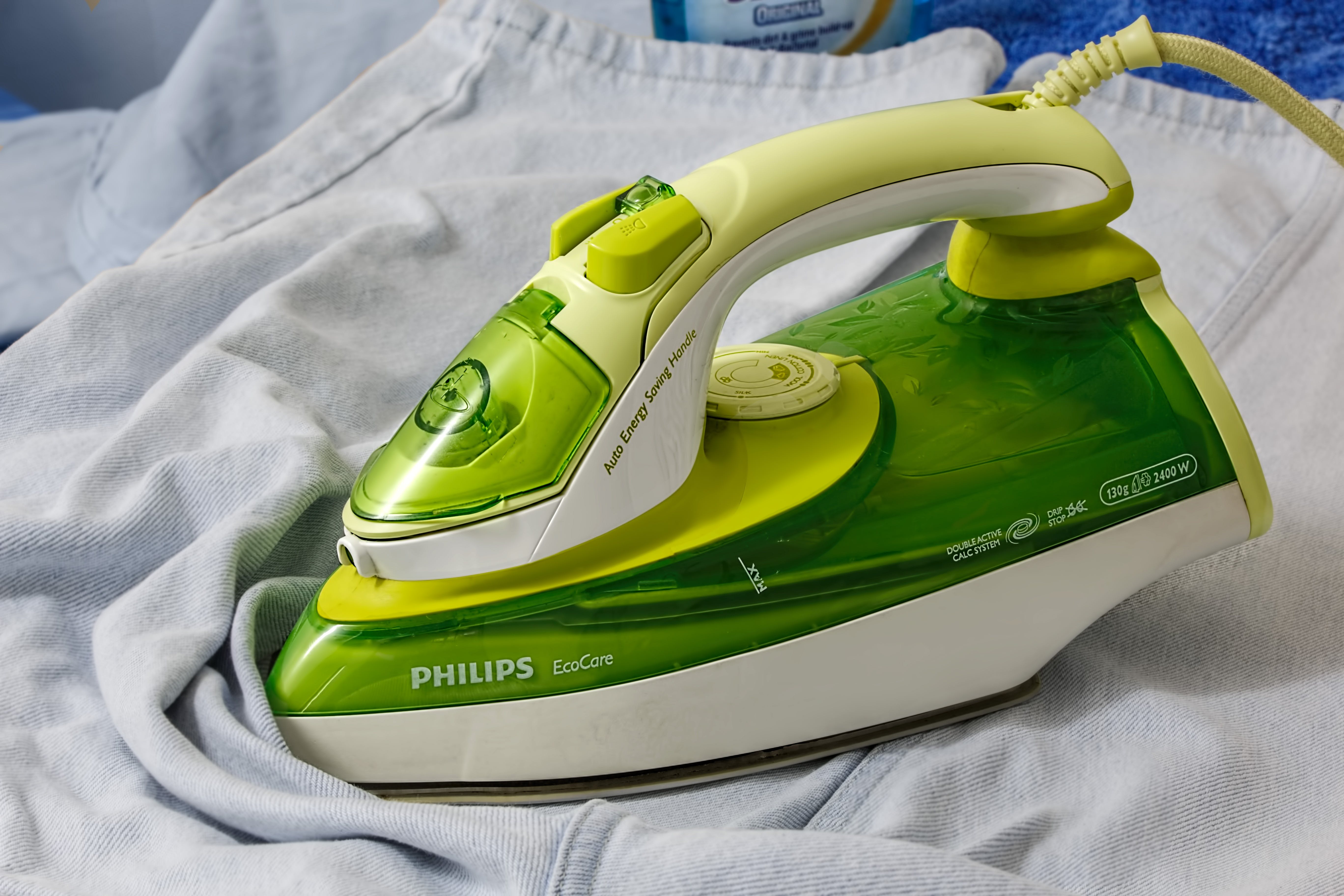 A green-white philips iron. | Source: Pexels