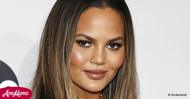 Chrissy Teigen, 32, puts her huge baby bump on display as she rocks a see-through black dress