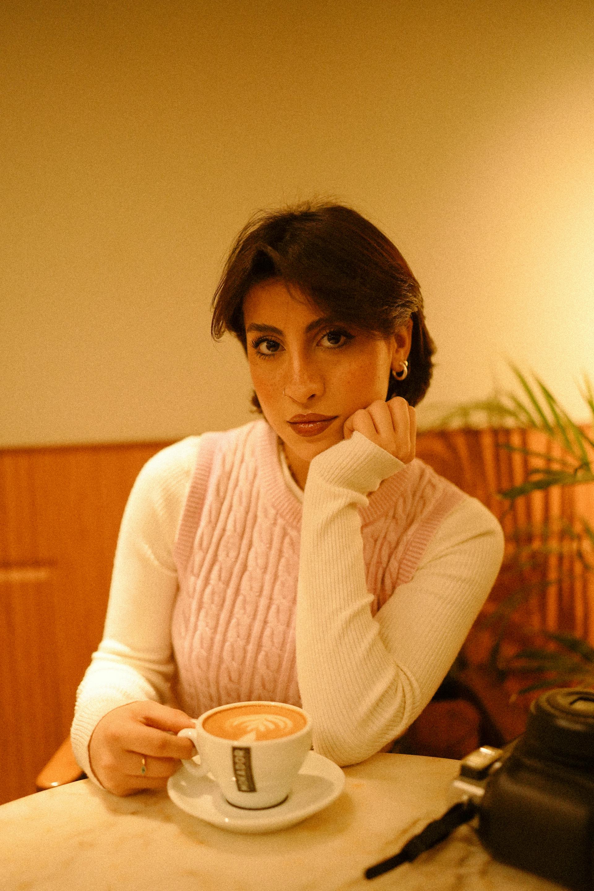 A woman sitting at a table | Source: Pexels