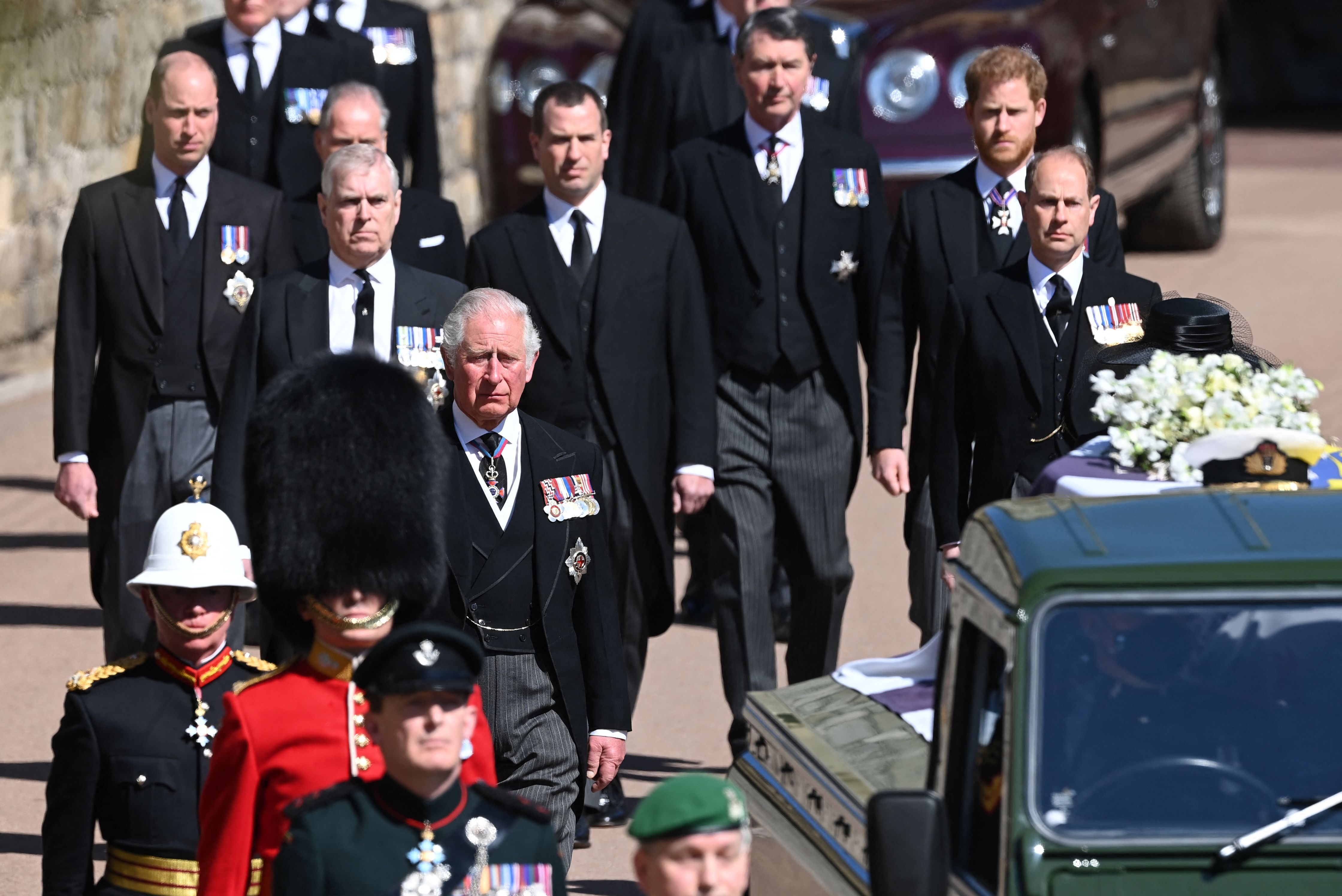 Charles, Prince of Wales and his sons Prince William and Prince Harry walk during the ceremonial funeral procession of Prince Philip on April 17, 2021 | Photo: Getty Images