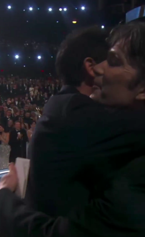 Cillian Murphy and Adrien Brody sharing a hug. | Source: YouTube/ABC News