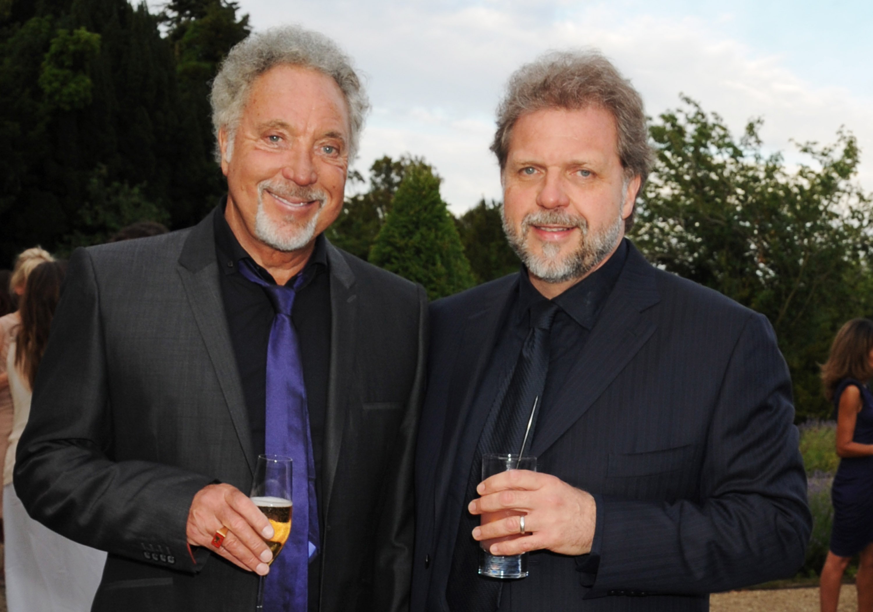 Tom Jones and his son Mark Woodward. July 10, 2010 | Source: Getty Images