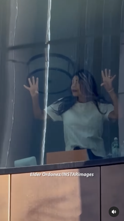 Wendy Williams presses her hands against the window, looking outward, posted on March 19, 2025 | Source: Instagram/tmz_tv