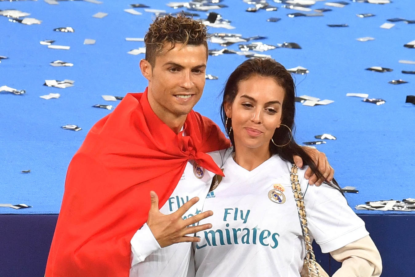 Cristiano Ronaldo poses with his girlfriend Georgina Rodriguez after his team won the UEFA Champions League final football match between Liverpool and Real Madrid at the Olympic Stadium in Kiev, Ukraine on May 26, 2018. | Source: Getty Images