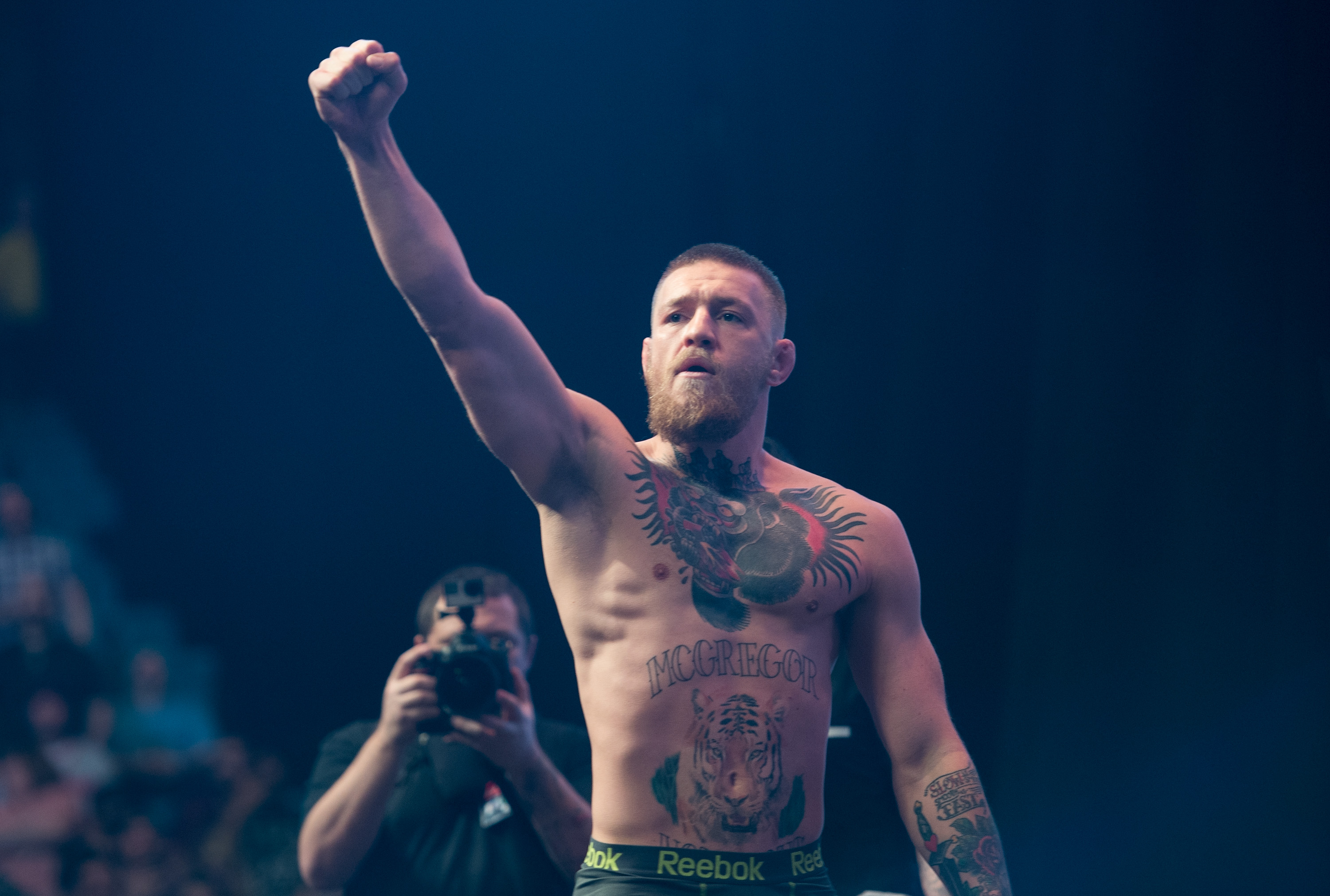 McGregor acknowledges the crowd after stepping off the scales ahead of UFC 196. Competing closer to his natural size gave the Irish fighter a healthier, more muscular appearance, marking the beginning of a new chapter as he tested himself against larger opponents.