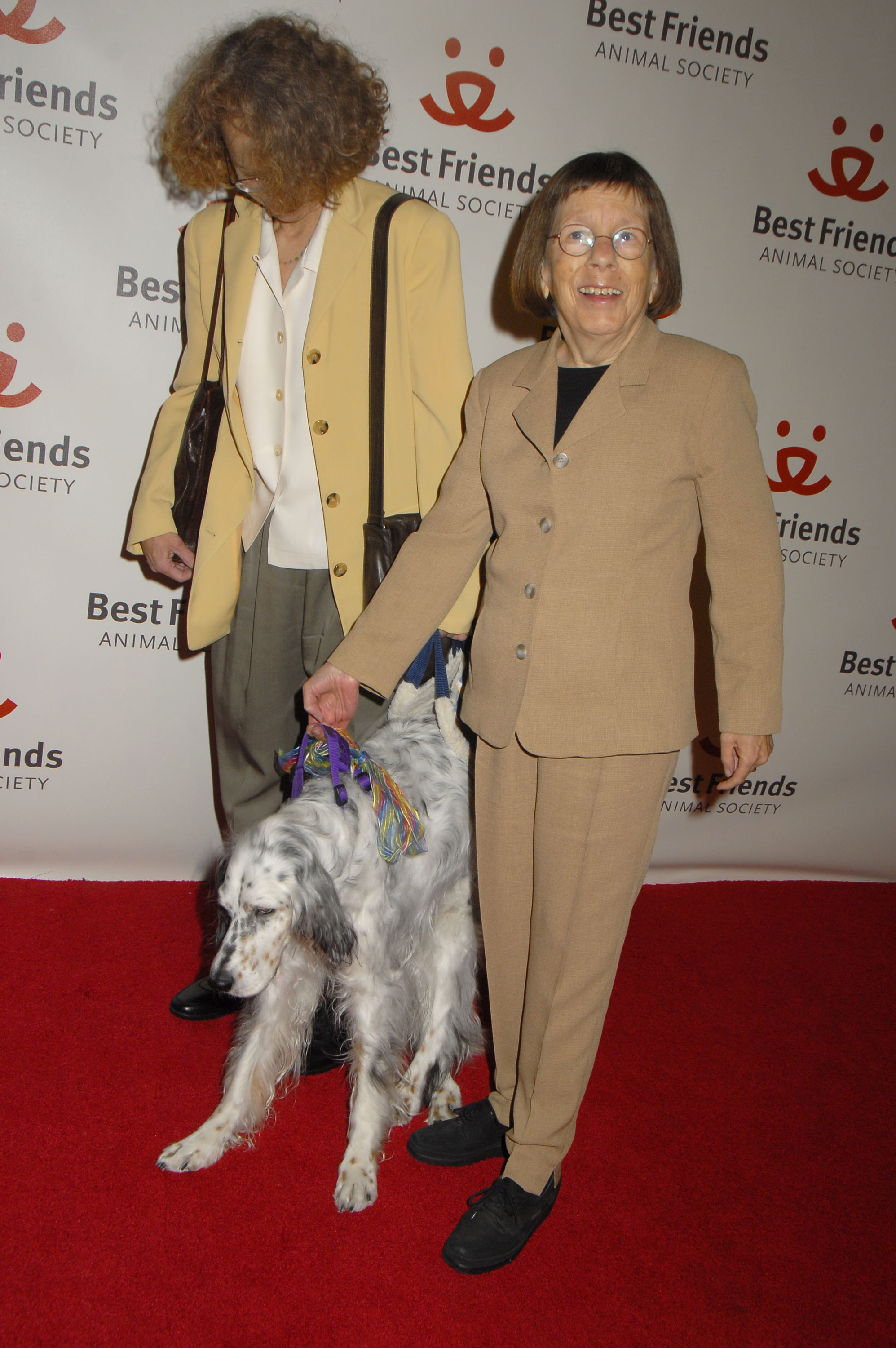 Linda Hunt and Karen Klein with their dog Stella at the Best Friends Animal Society's 15th Annual Lint Roller Party on November 13, 2008, in Hollywood, California | Source: Getty Images