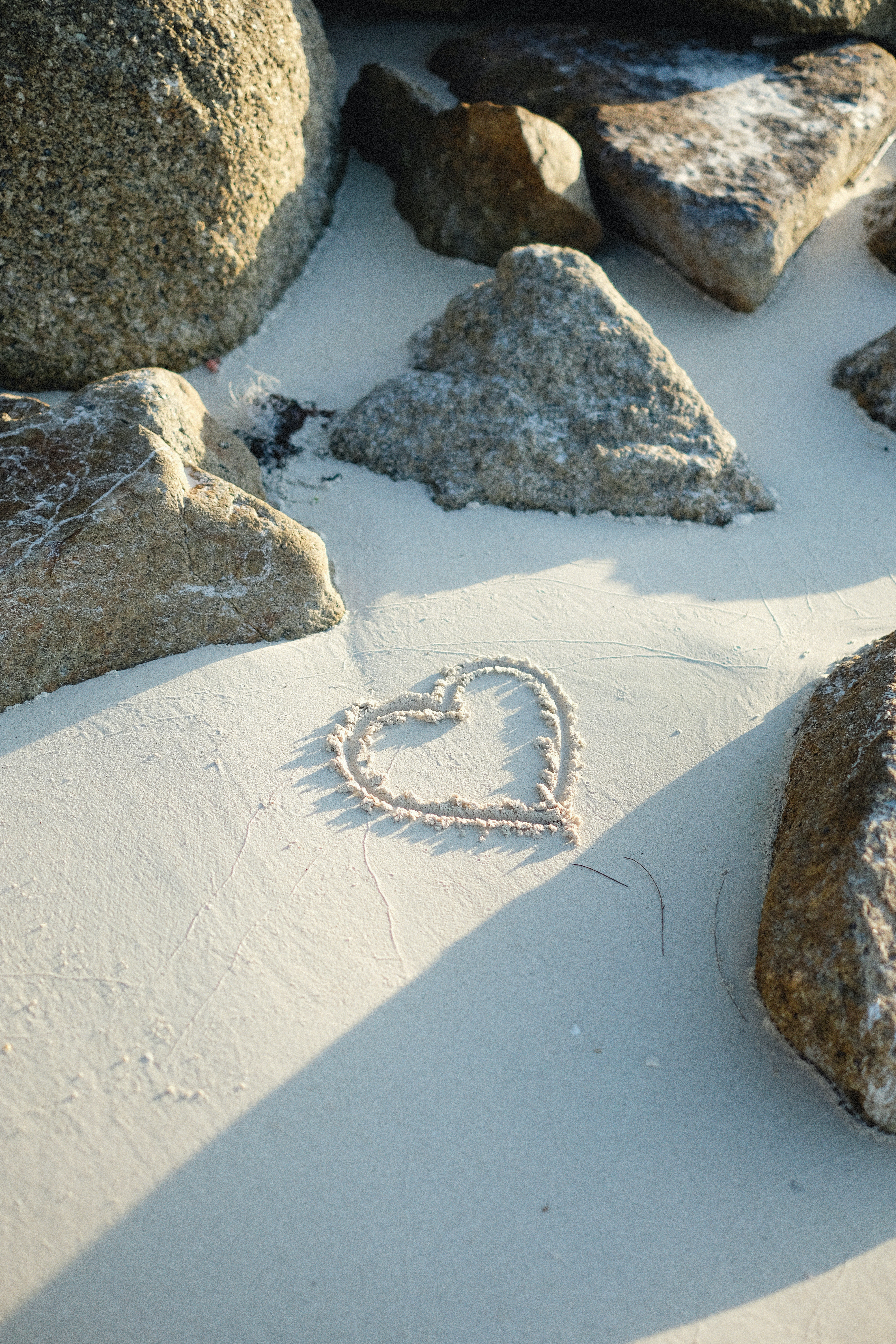 Heart shape on sand. | Source: Pexels