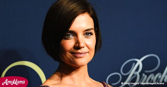 Katie Holmes shows off cleavage in plum-colored sleeveless gown during a recent appearance