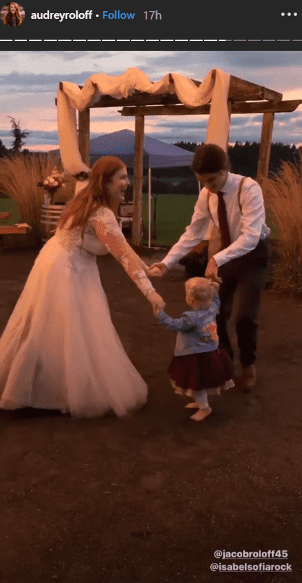 Jacob Roloff and Isabel Rock dancing with Ember Roloff on their wedding day | Photo: instagram.com/audreyroloff