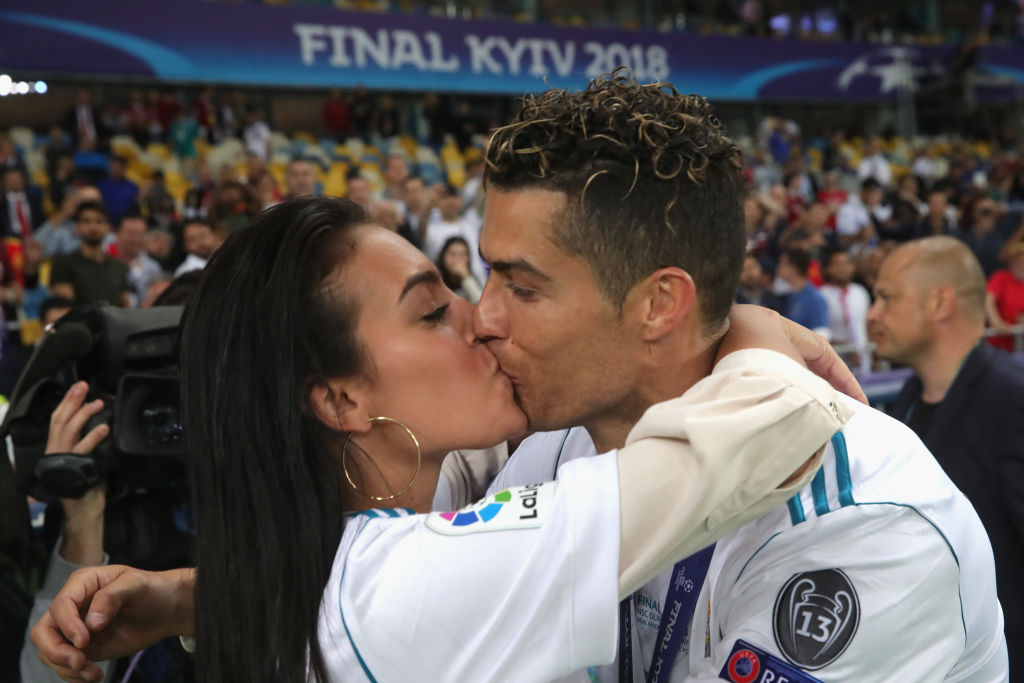 Cristiano Ronaldo of Real Madrid celebrates with Georgina Rodriguez following his side's victory in the UEFA Champions League Final between Real Madrid and Liverpool at NSC Olimpiyskiy Stadium, on May 26, 2018, in Kiev, Ukraine. | Source: Getty Images