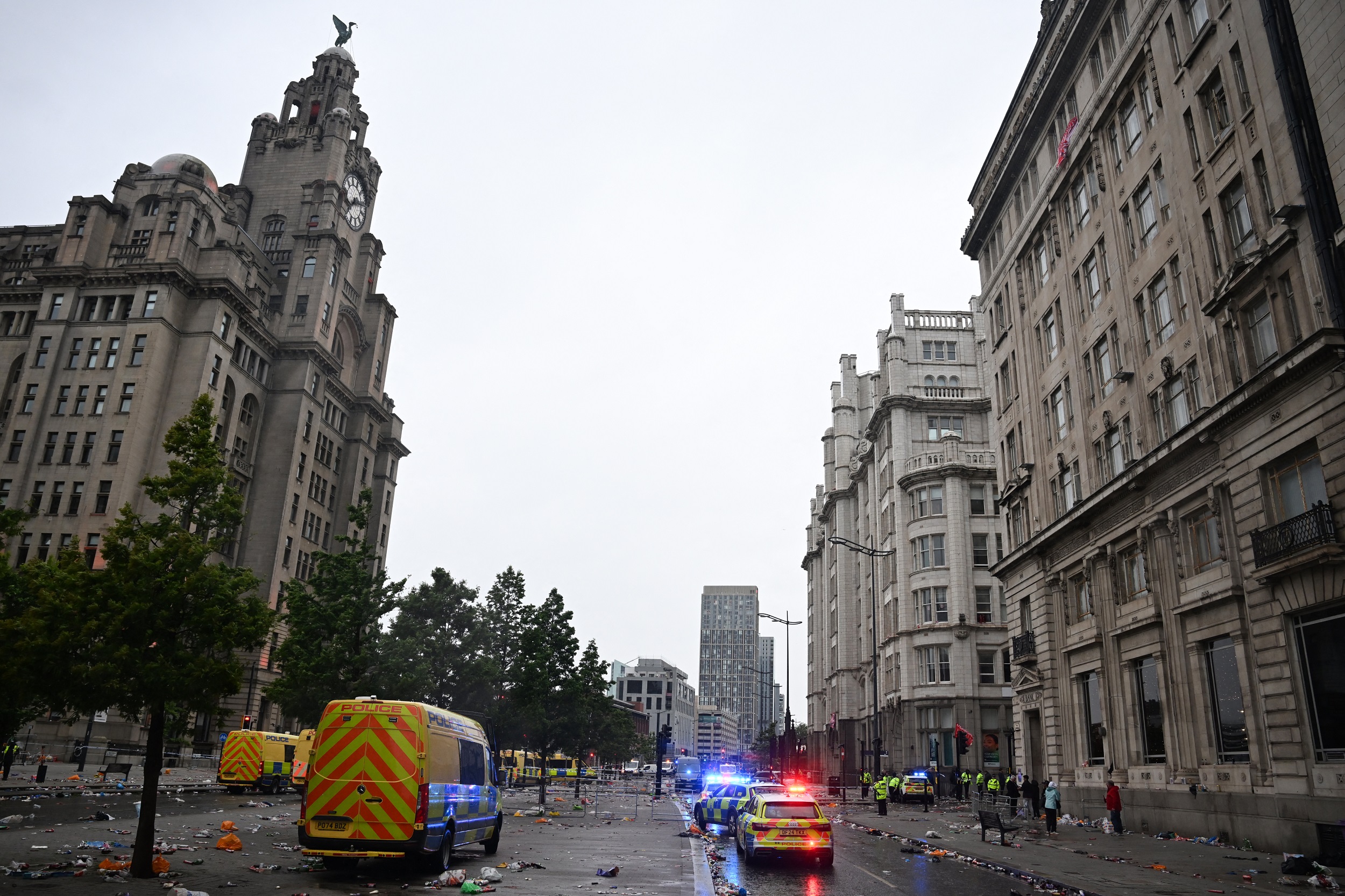 Police vans are parked along The Strand by the Royal Liver Building, following an incident on the sidelines of Liverpool's Premier League title victory parade, in Liverpool, north-west England on May 26, 2025 | Source: Getty Images