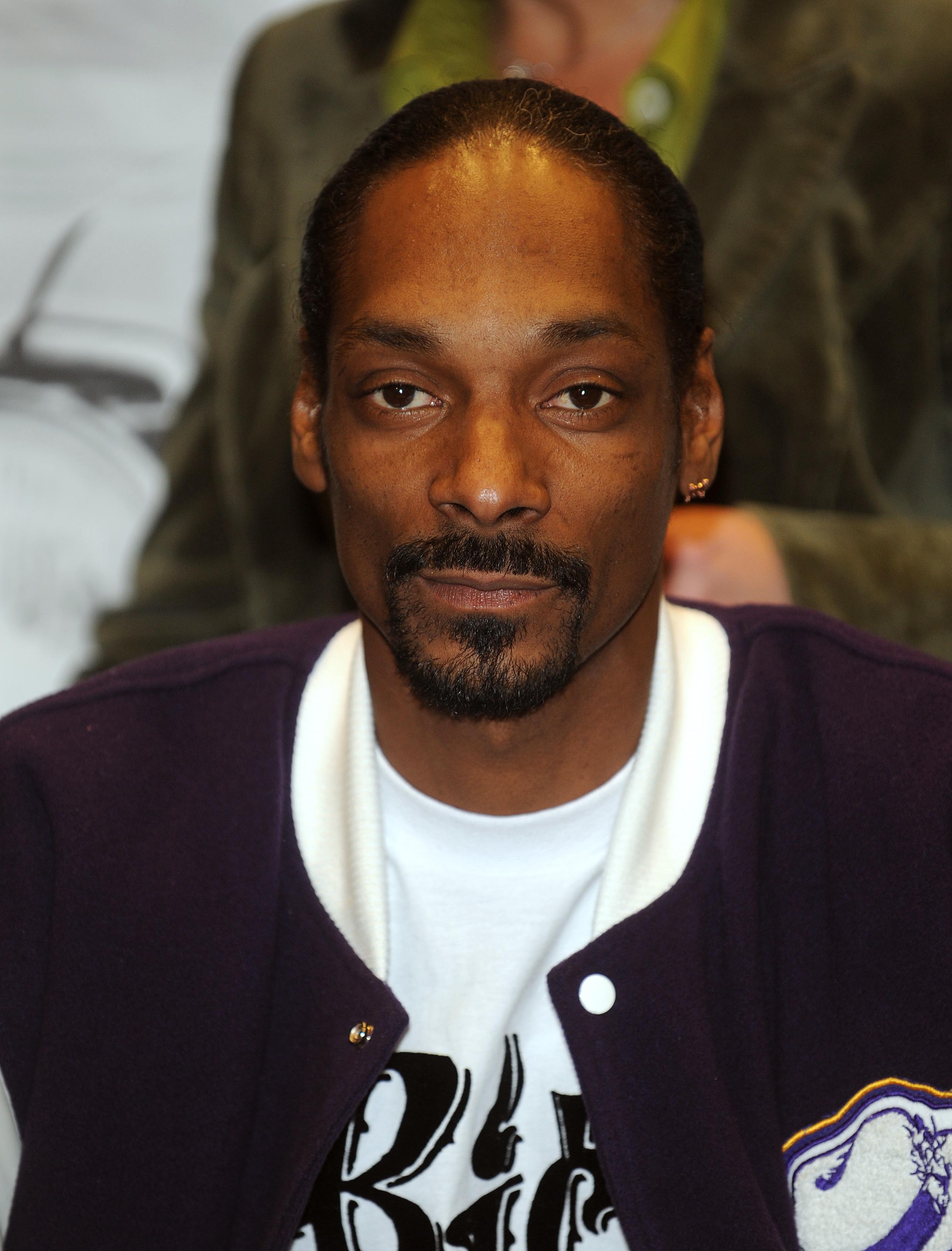 Snoop Dogg signs copies of "Ego Trippin'" at Best Buy  in New York City on March 12, 2008 | Source: Getty Images