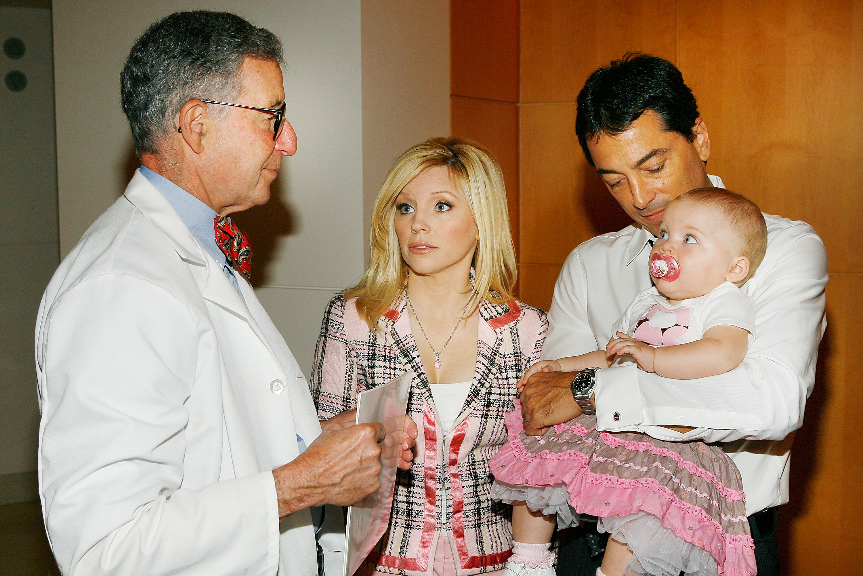 Renee Sloan and Scott Baio with their daughter Bailey and Dr. Stephen Cederbaum in California in 2008 | Source: Getty Images