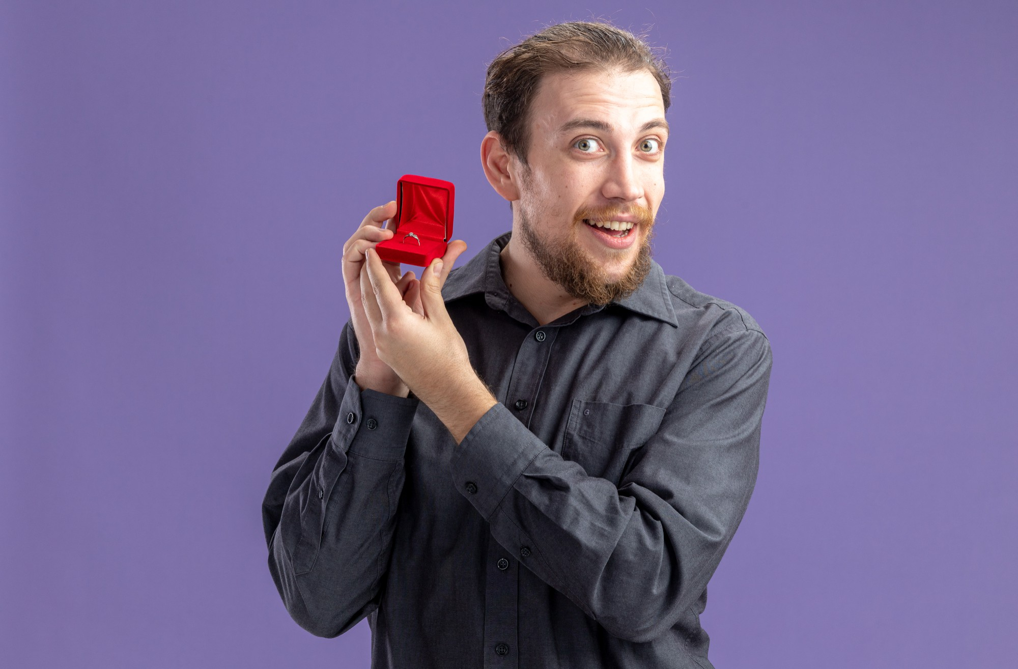 A happy man showing off a ring in a box | Source: Freepik