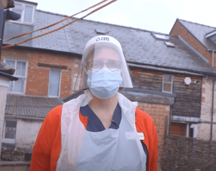Dr. Anne Hampton dressed up in PPE during her visit to The Steppe care home. | Source: YouTube/SWNS.