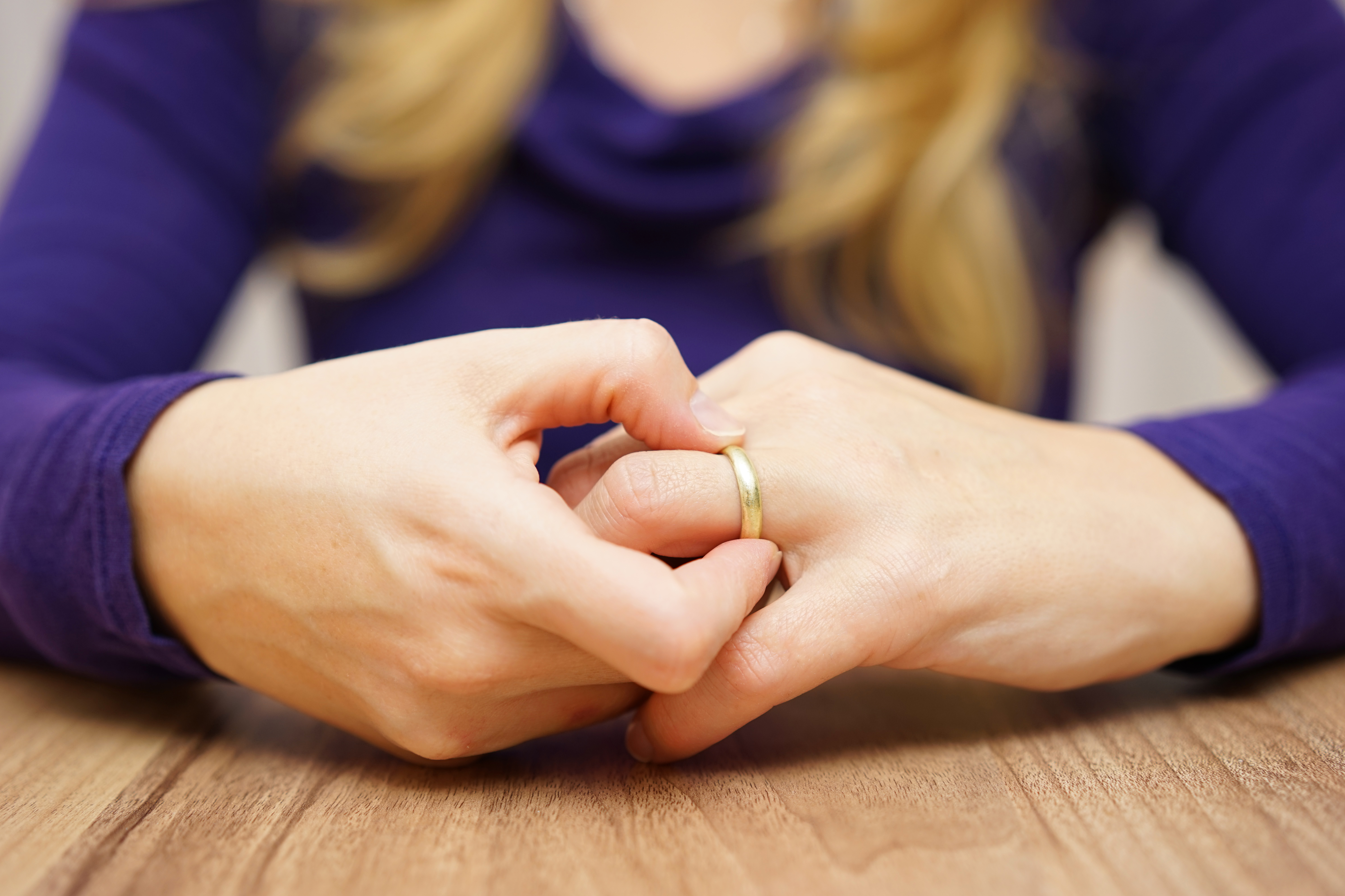 A woman touching her wedding ring | Source: Shutterstock