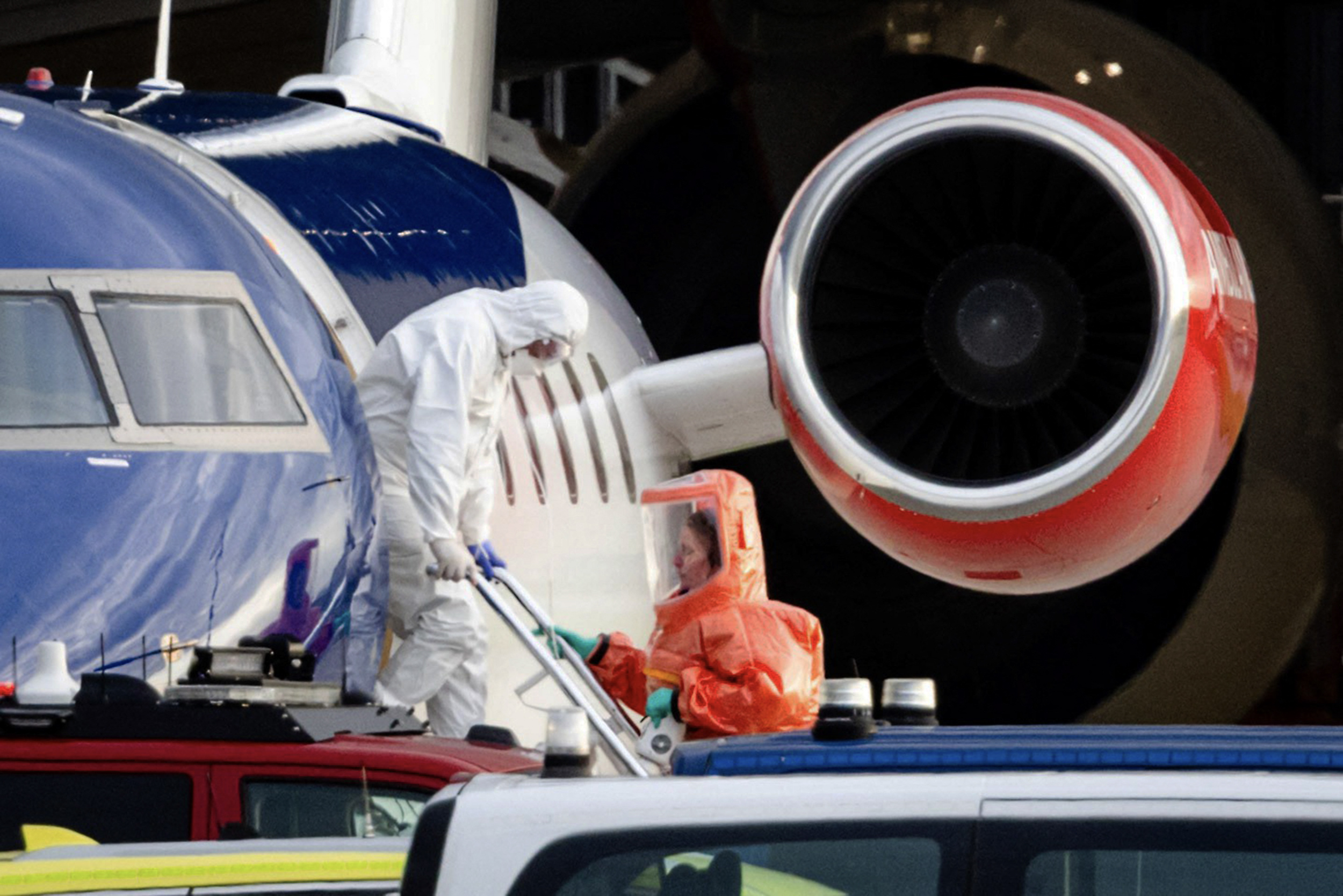 A person in a white hazmat suit disembarking a Bombardier Challenger 605 medical aircraft allegedly carrying some of the passengers believed to be infected with hantavirus from the cruise ship MV Hondius on May 6, 2026 | Source: Getty Images