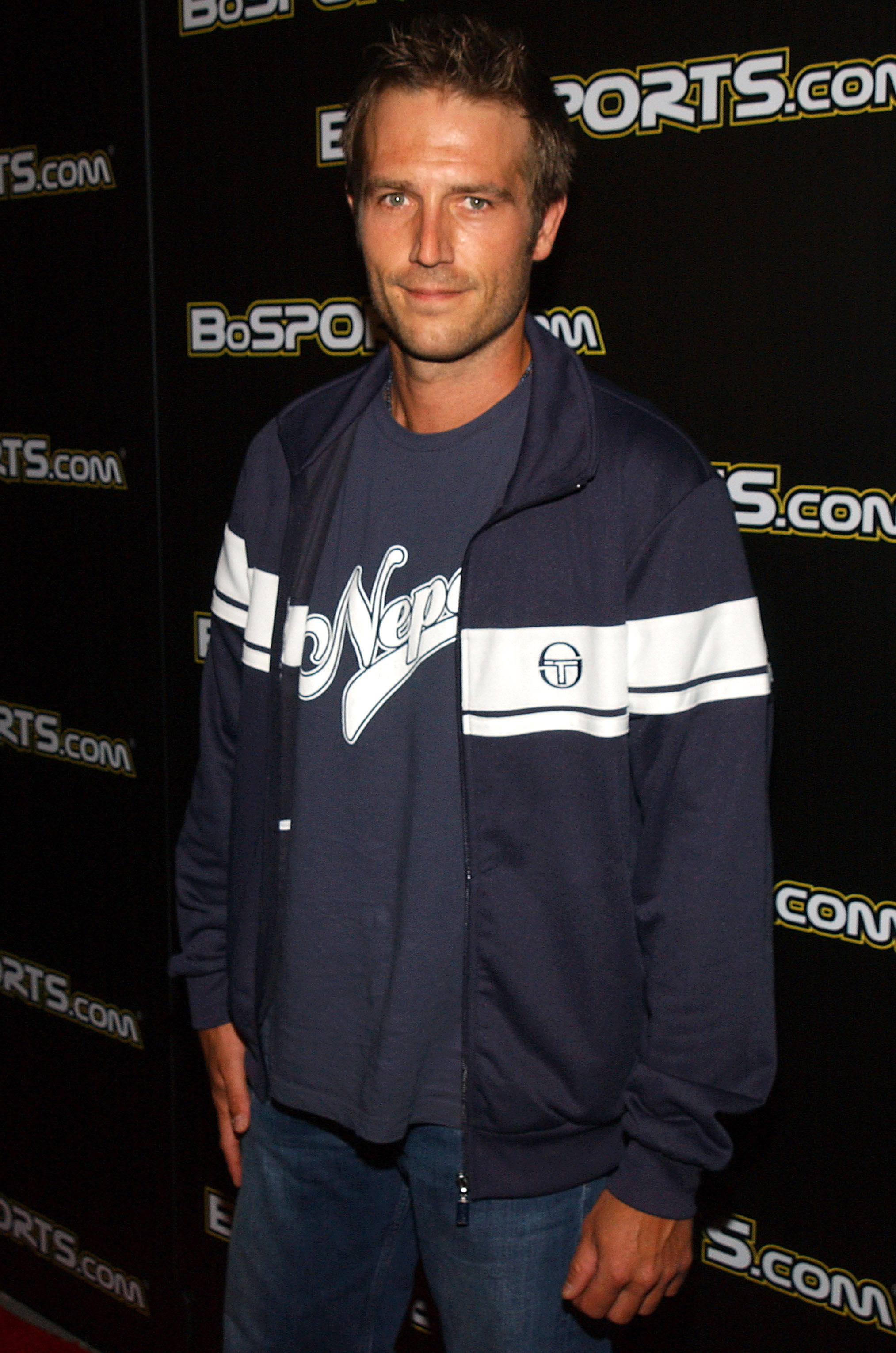 Casually dressed in a sporty jacket and jeans, Michael Vartan attends a celebrity poker event in Beverly Hills, showing off his laid-back style during the height of his fame.