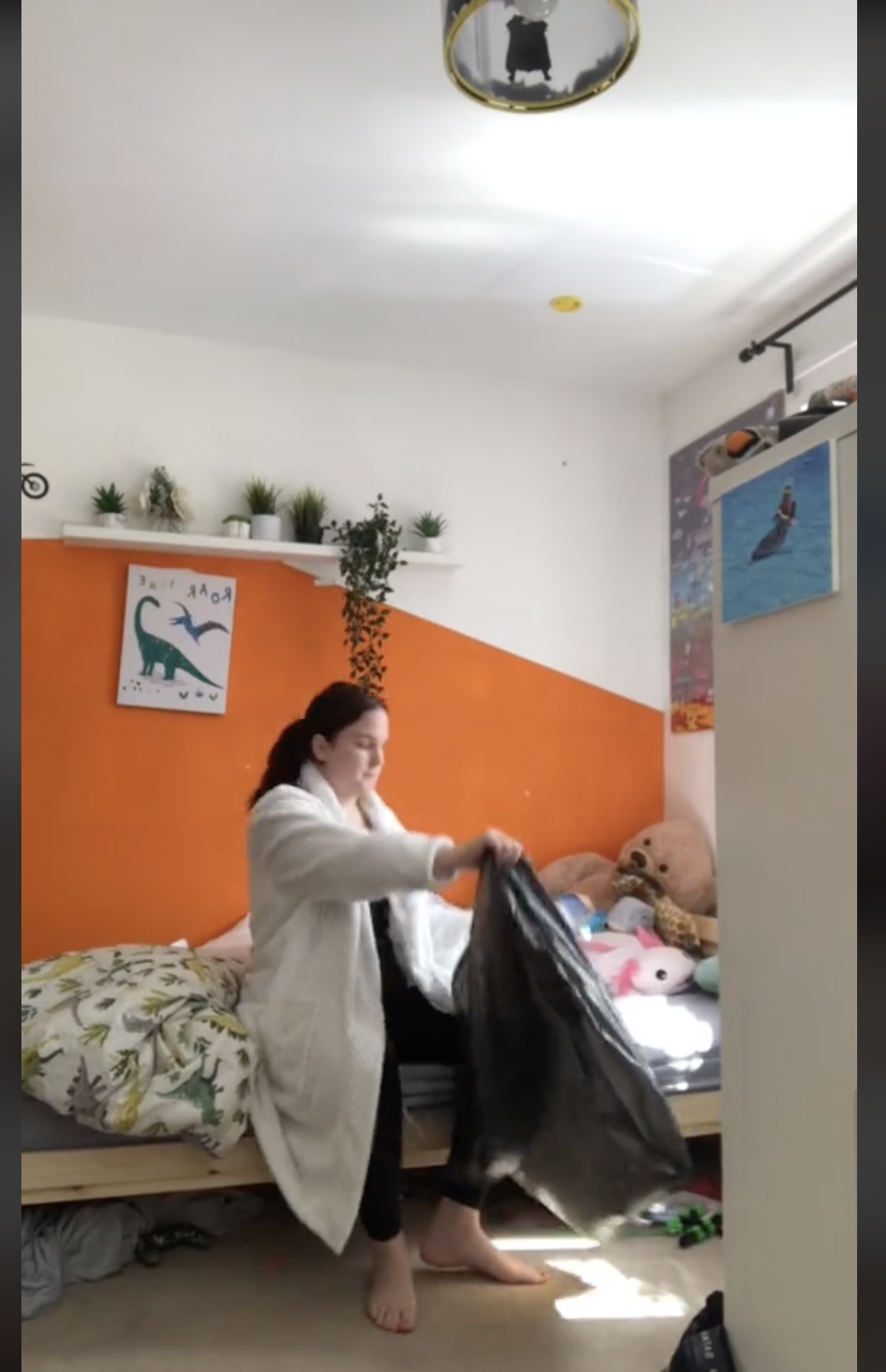 Katie Johnson is pictured clearing up stuff from her sons' room in a viral video | Source: TikTok/katiejohnston07