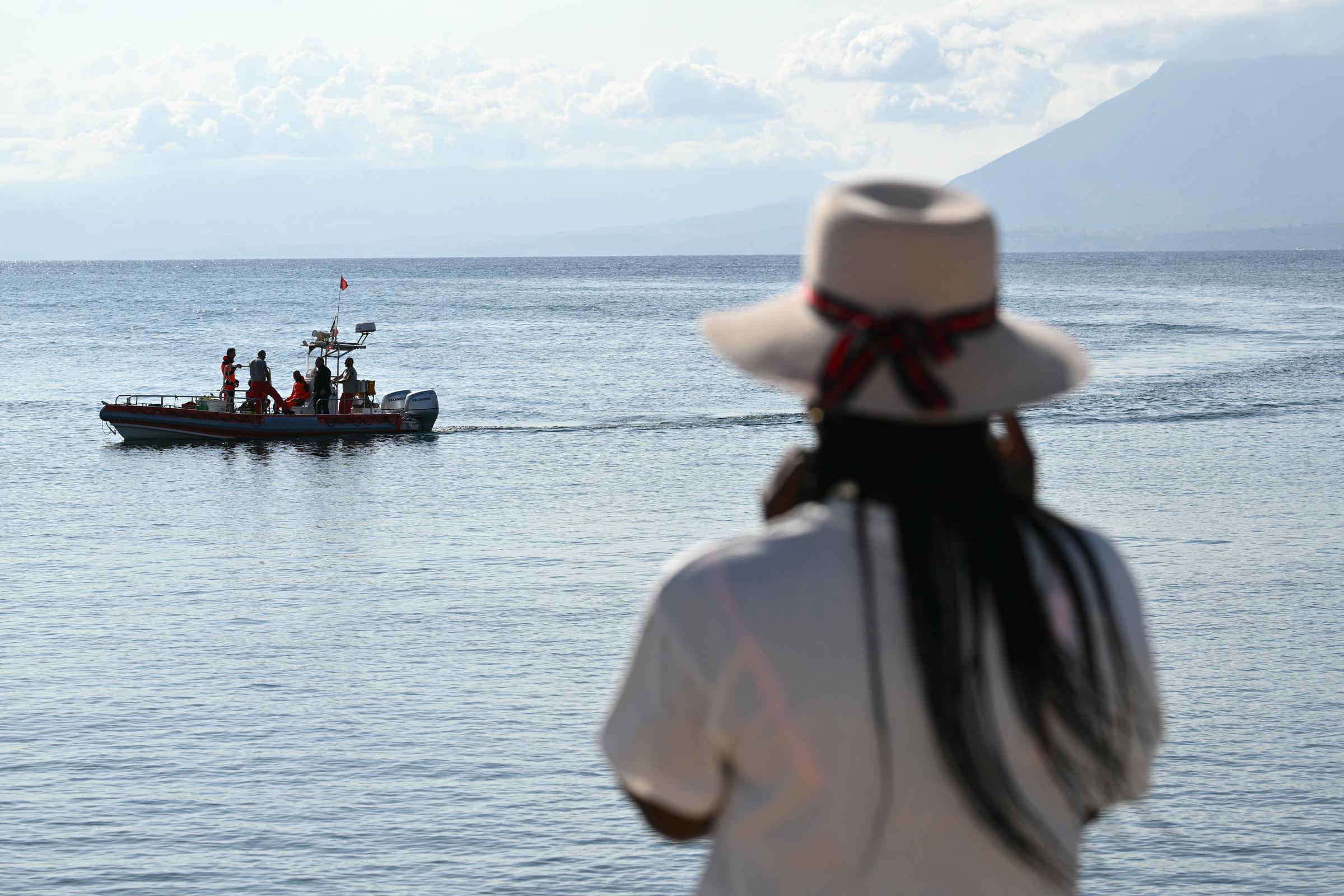 A woman watching rescue teams at work in Porticello, Italy, on August 21, 2024, two days after the British-flagged luxury yacht Bayesian sank. | Source: Getty Images