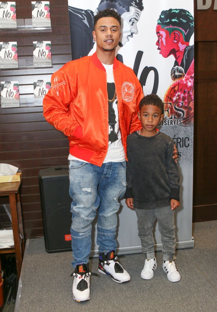 Lil' Fizz (L) and son Kamron David Frederic attend the Hazel-E, Lil' Fizz and Brittani Williams book signing for "Girl Code" and "No Excuses" at Barnes & Noble at The Grove in Los Angeles, California | Photo: Getty Images