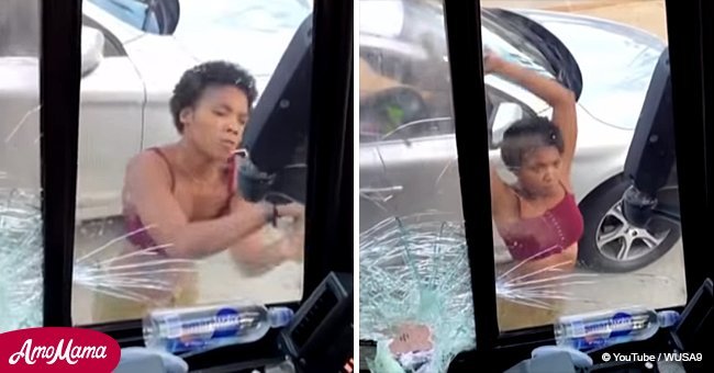 Dramatic footage shows furious woman smashing a bus window