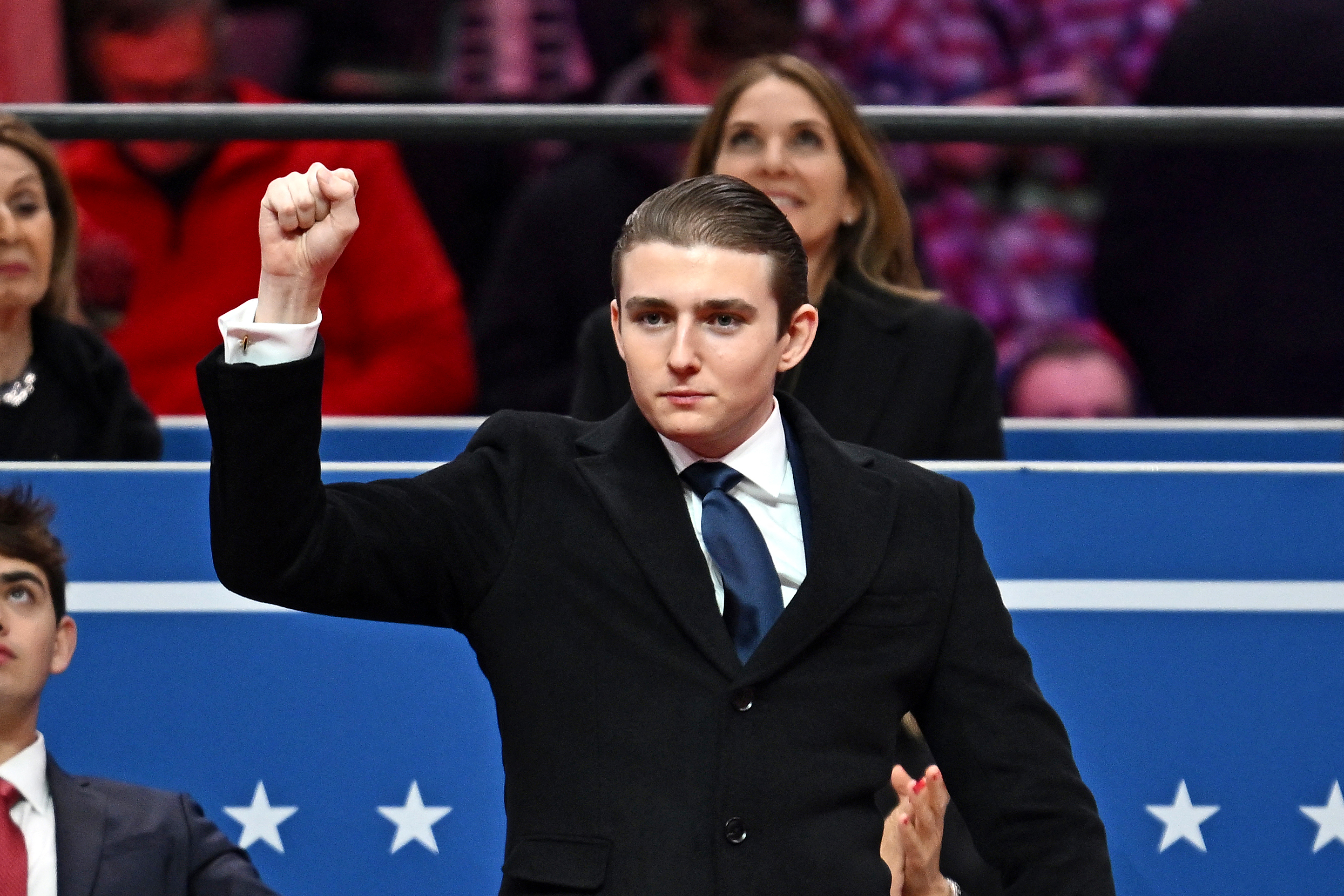 Barron Trump gestures at his father, US President Donald Trump's inaugural parade inside Capital One Arena, in Washington, DC, on January 20, 2025 | Source: Getty Images