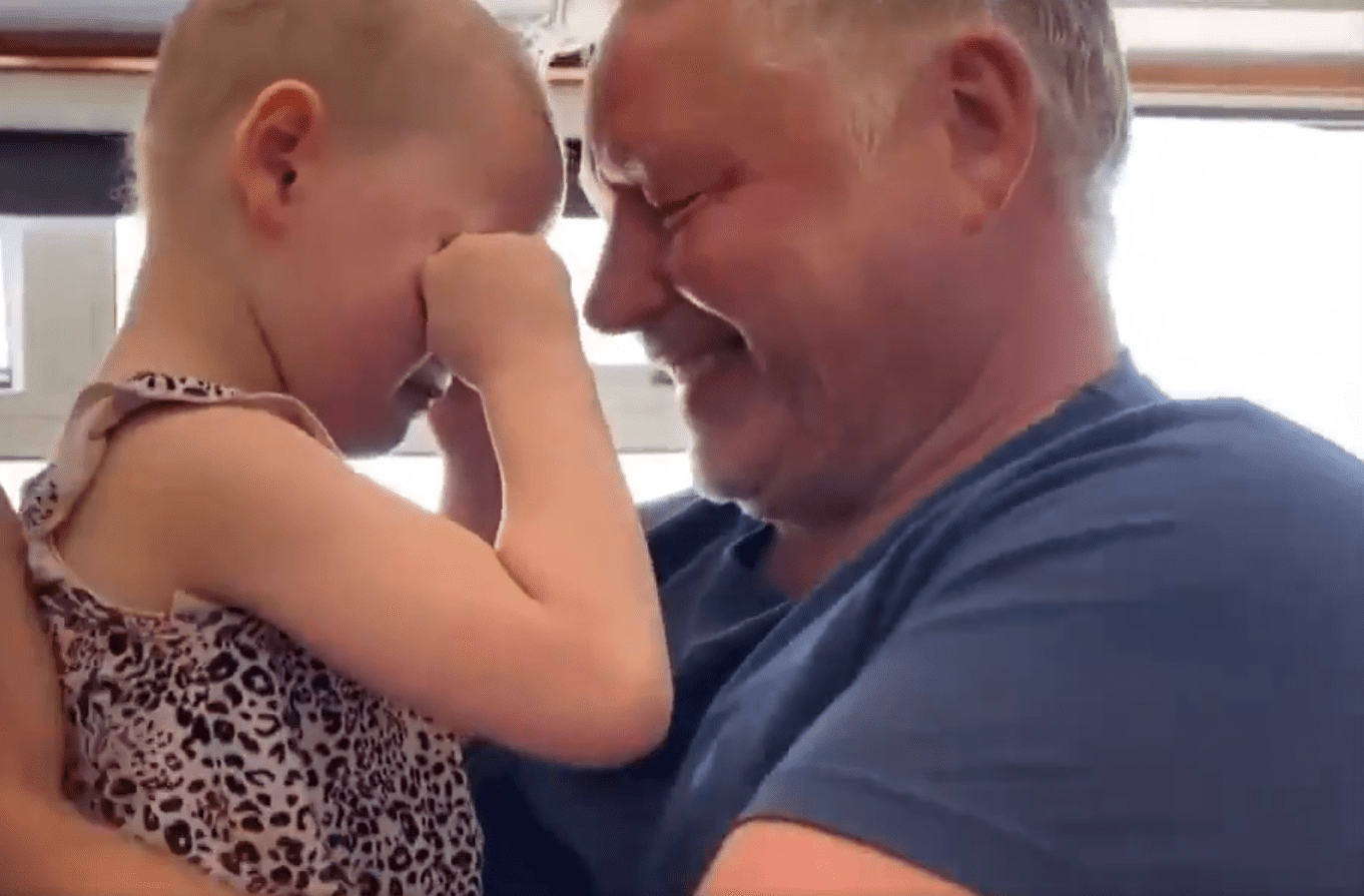 Mila Sneddon couldn't help but cry tears of joy recently when she finally got to hug her dad Scott for the first time in seven weeks. | Photo: Twitter/RexChapman