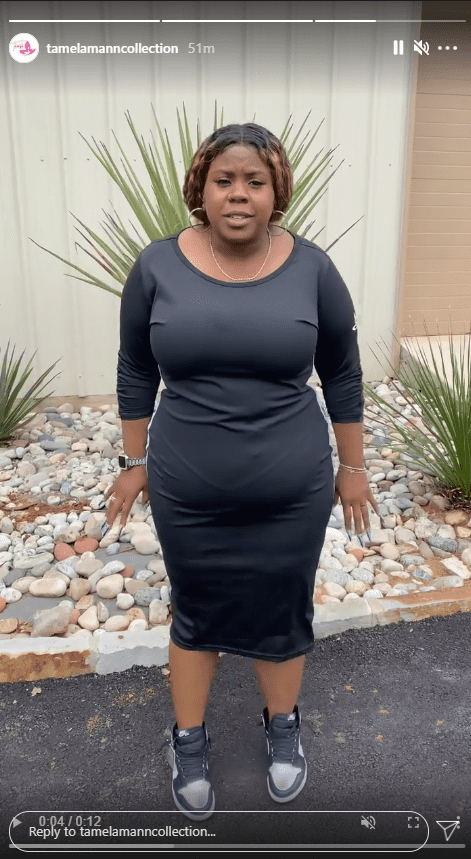 Tia Mann showcases a dress from her mother's clothing brand, Tamela Mann Collection | Photo: Instagram/tamelamanncollection