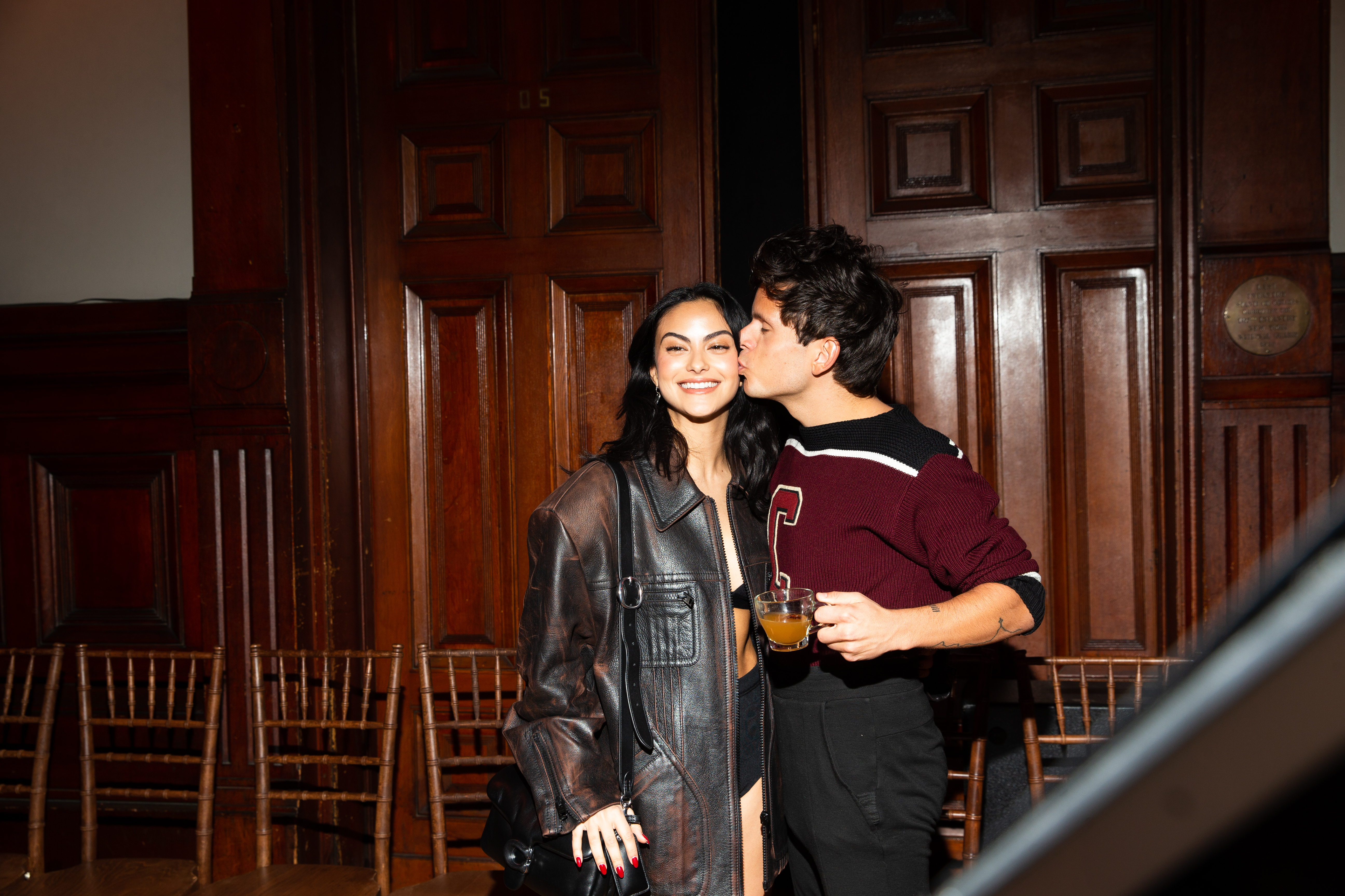 Camila Mendes and Rudy Mancuso pose at the Coach Fall 2023 Ready To Wear Fashion Show at Park Avenue Armory on February 13, 2023, in New York City, New York | Source: Getty Images